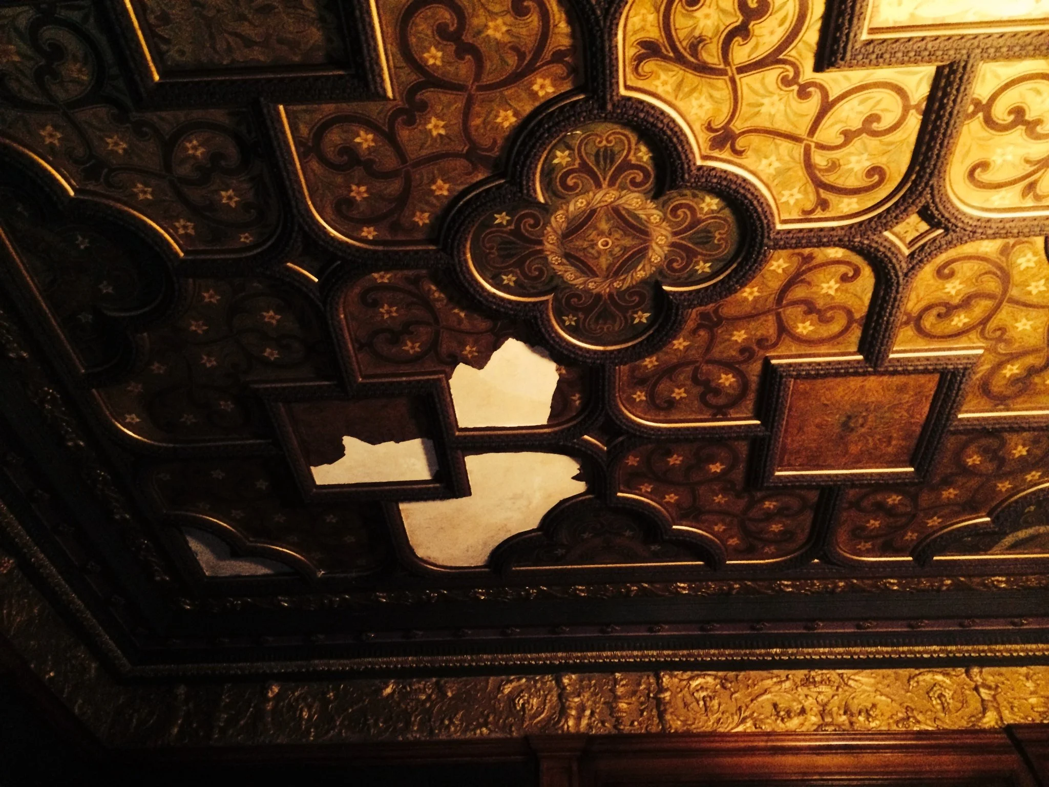 Water damaged painted & gilded ceiling.
