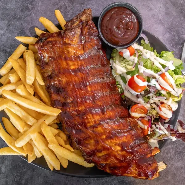  
 USA PORK RIBS 
 
Full Rack Slow cooked USA Pork Ribs, Covered in Smokey BBQ sauce, w/ crispy seasoned fries & ranch salad.
