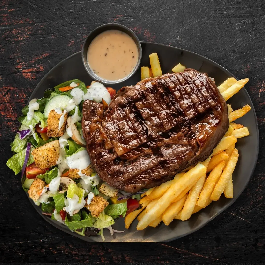  
 NY STRIPLOIN 
 
350g New York steak, served with seasoned fries, ranch salad & Ale gravy.