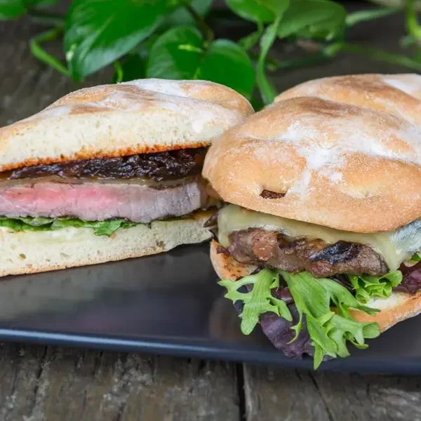  
 STEAK SANDWICH 
 
Toasted Turkish roll, char-grilled NY sirloin, ranch sauce, crispy lettuce, Swiss cheese, onion jam & house tomato chutney.