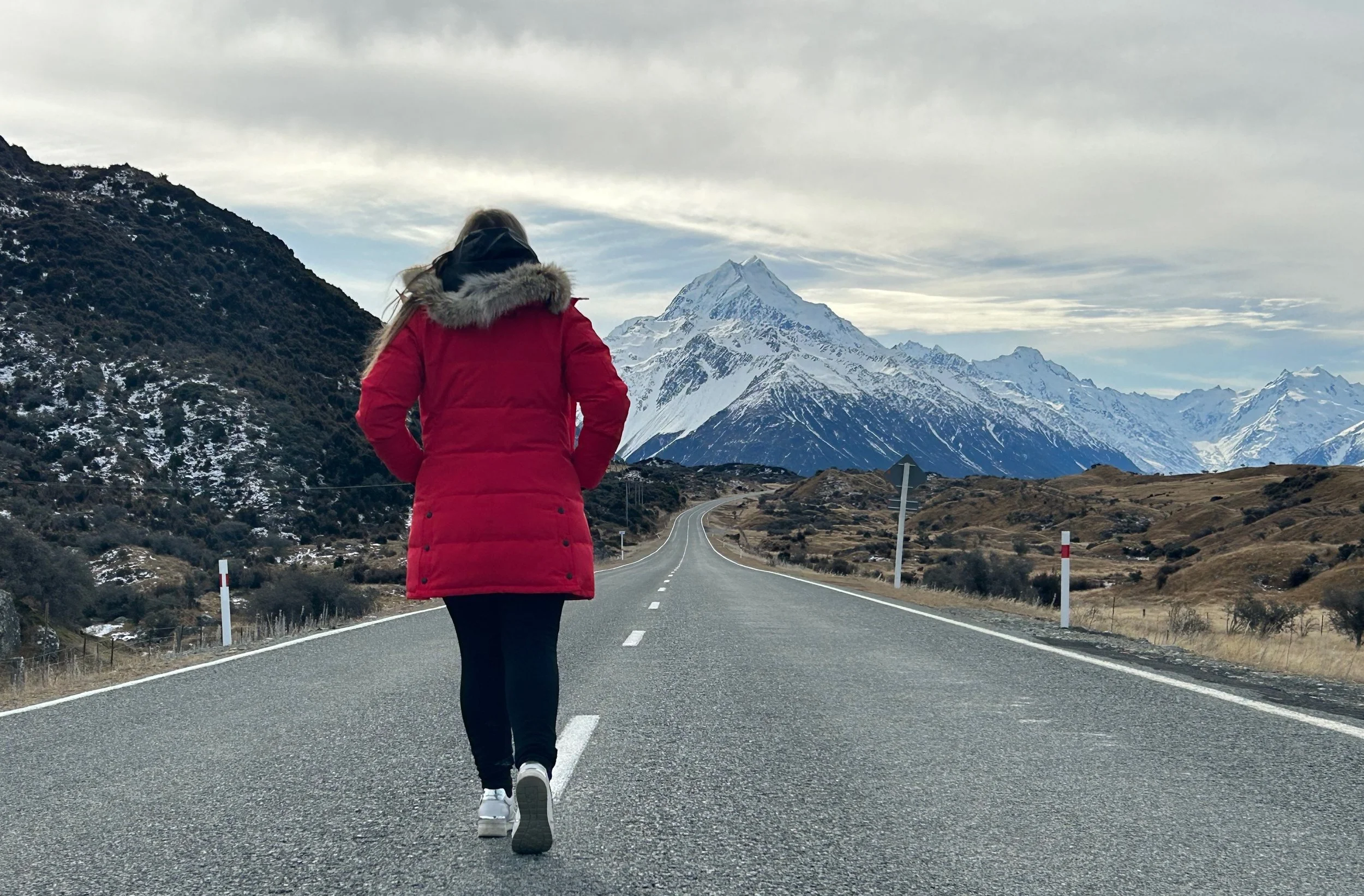 A lady walking towards Aoraki/Mt Cook