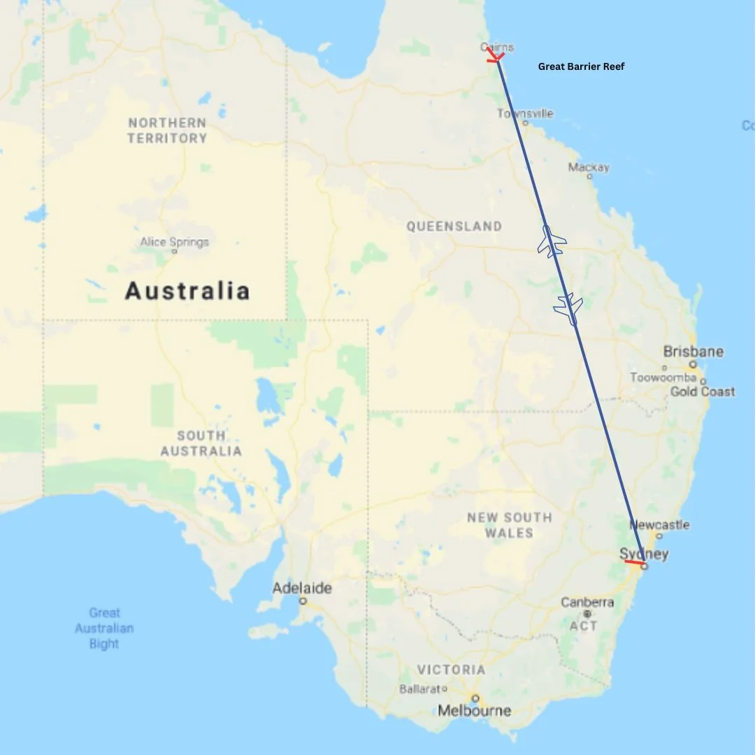 Map showing a flight route from Sydney to Cairns in Australia, with a flight path over eastern Australia and the Great Barrier Reef visible offshore.