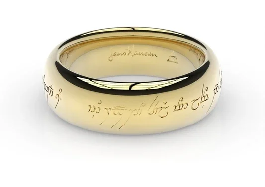Gold ring with engraved script writing on the exterior and interior surfaces.