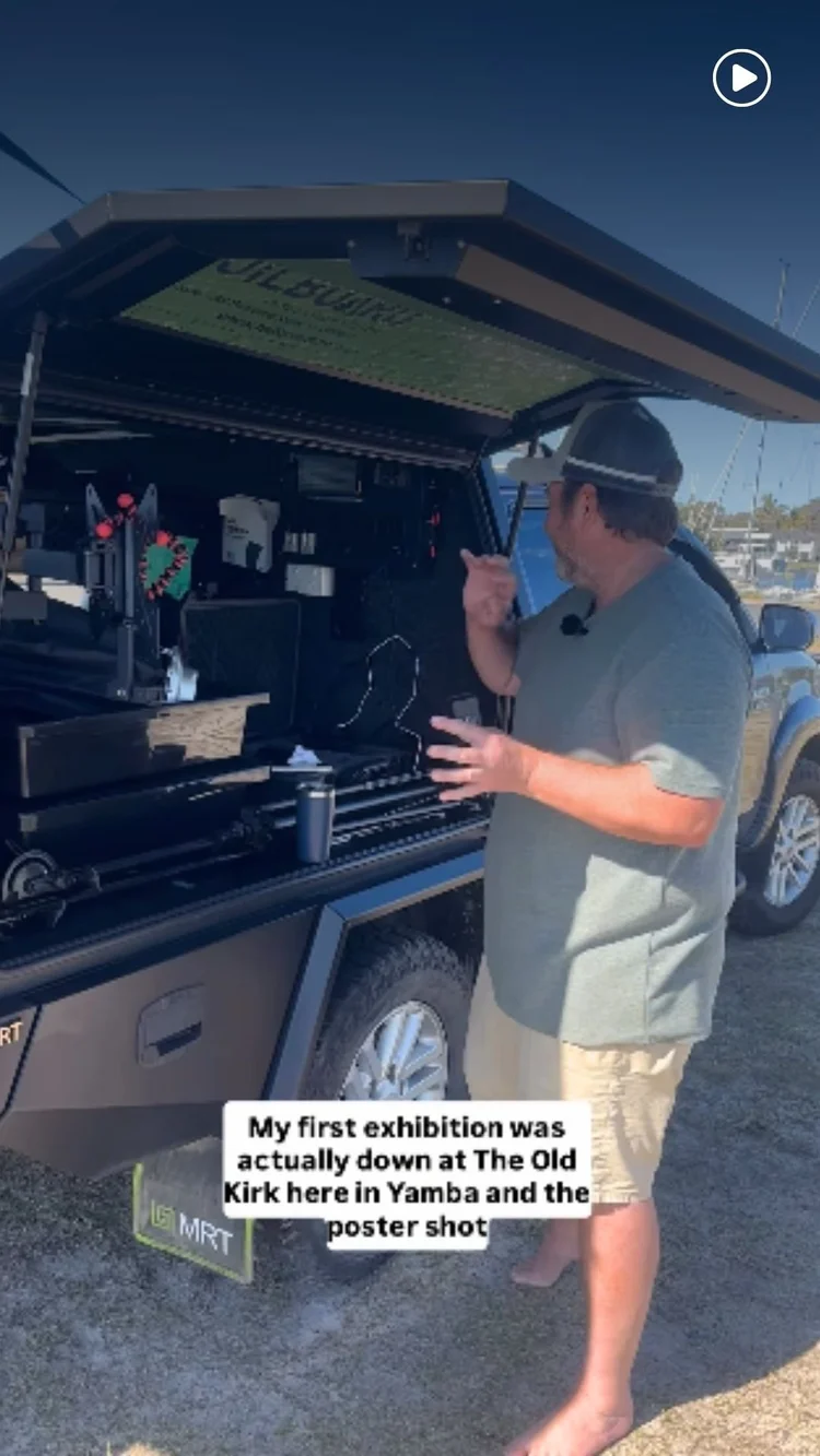 Stuart Murphy talking about his photography beside his vehicle
