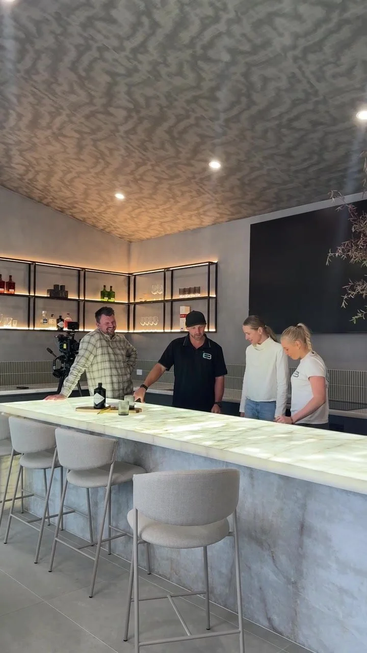 interior design discussion around a kitchen island during a site visit.