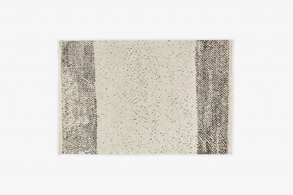 Pale rectangular rug with subtle textured horizontal bands.