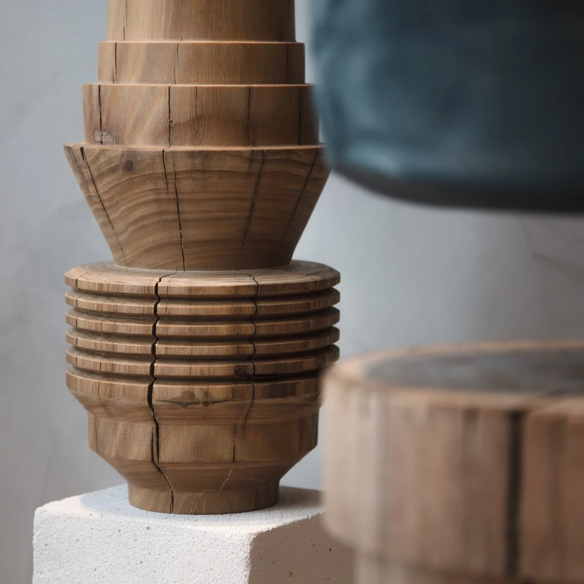 Stacked handcrafted timber bowls with carved surface details.