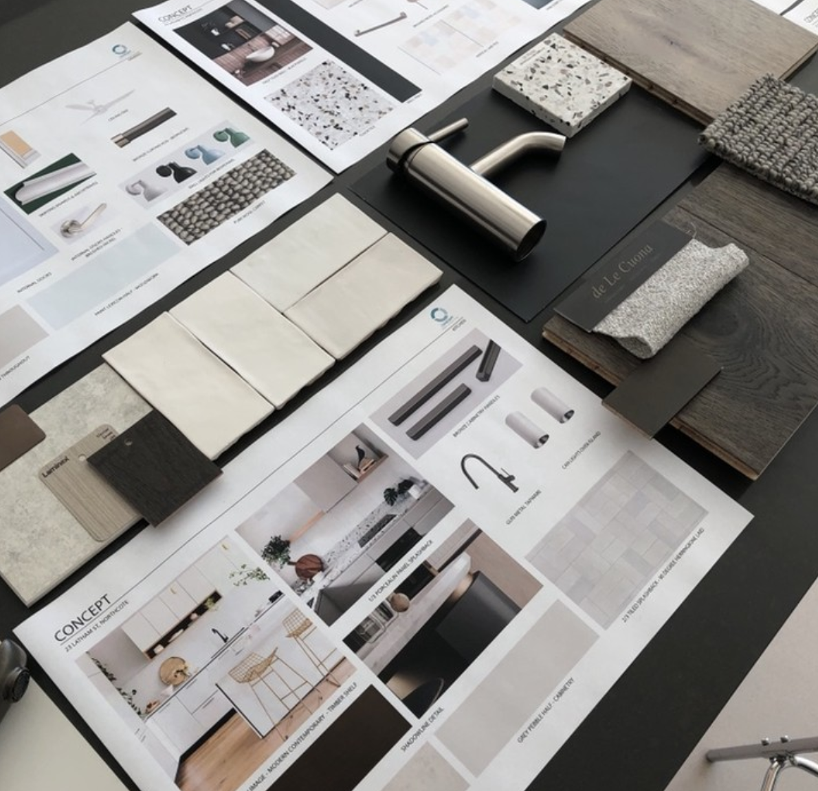 Kitchen plans beside timber, stone, fabric and hardware samples.