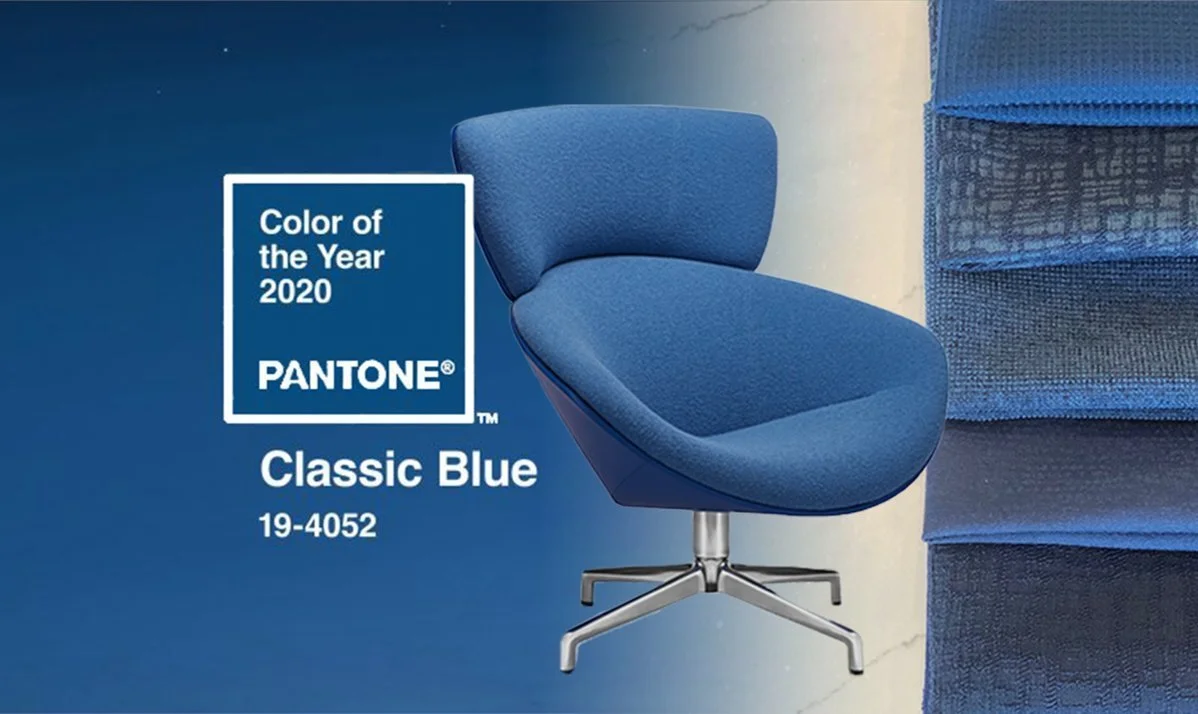 Blue upholstered chair alongside a Pantone Classic Blue colour reference.