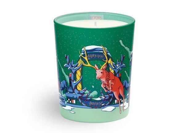 Green illustrated candle vessel with a decorative tropical motif.