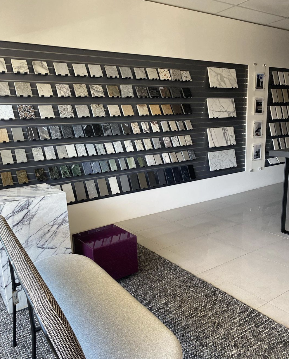 Studio seating beside an extensive wall display of material and finish samples.