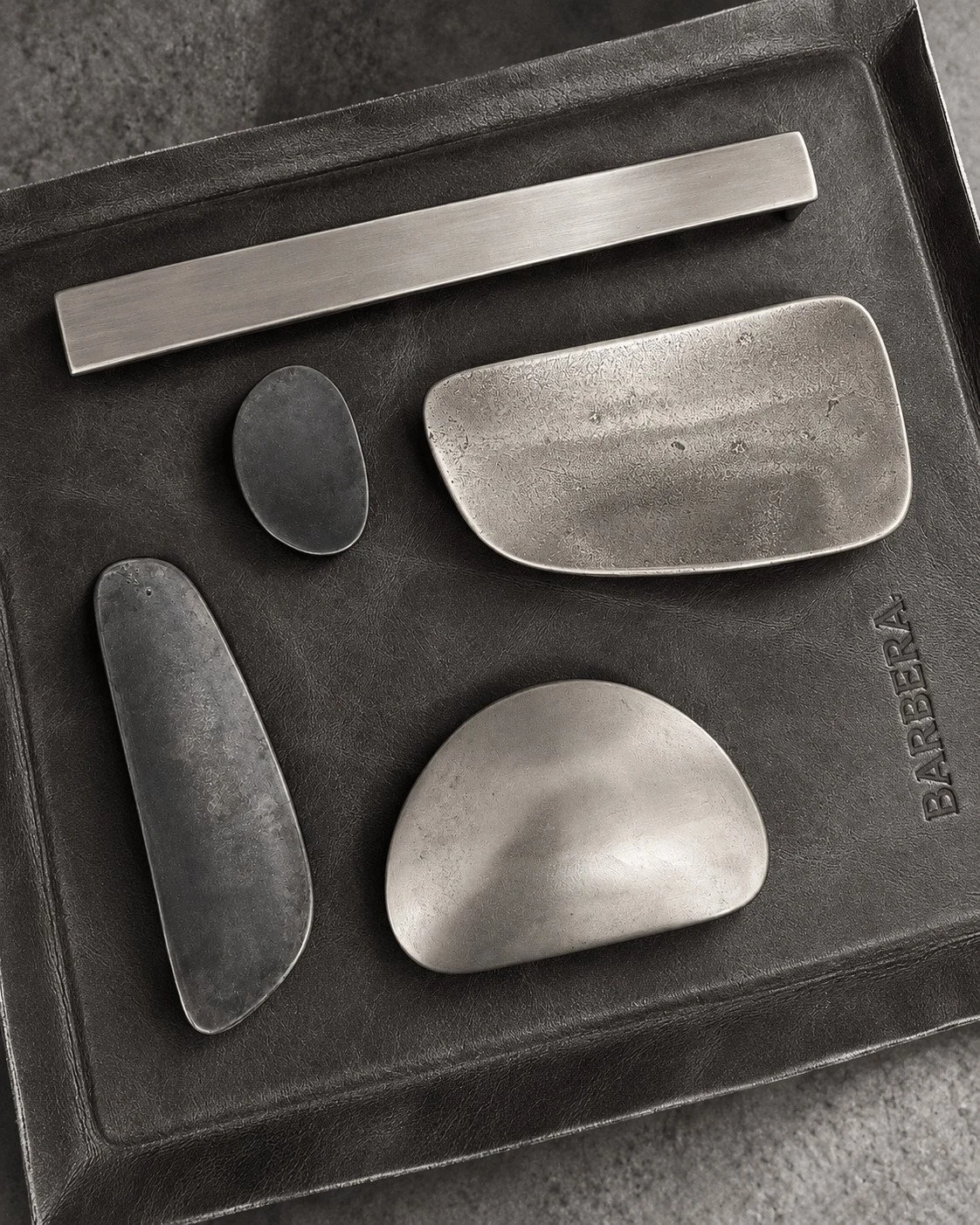 Metal finish and sculptural hardware samples selected for the Lorde House interiors.