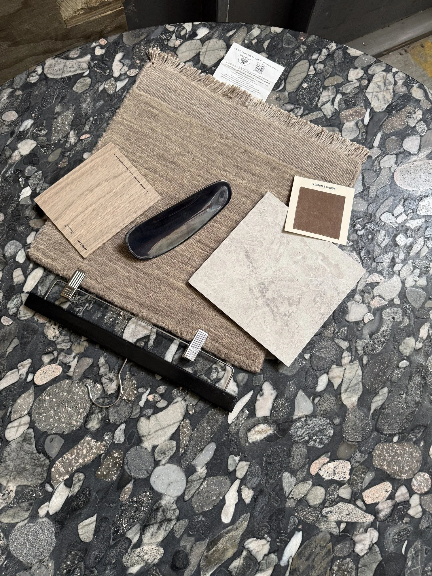 Stone and textured fabric samples reviewed together on site.