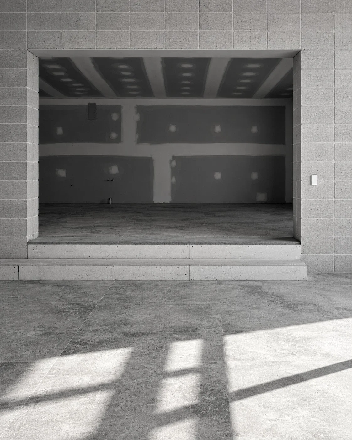 Lorde House fireplace wall under construction with a broad recessed opening.