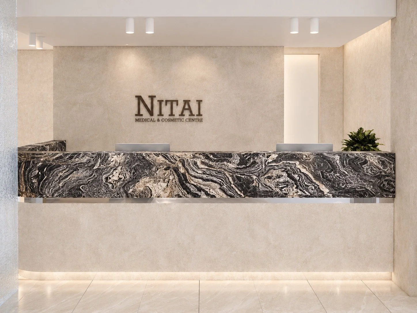 expressively veined natural stone defines the reception desk, set against venetian plaster walls, custom brass lettering and textured glass screening.