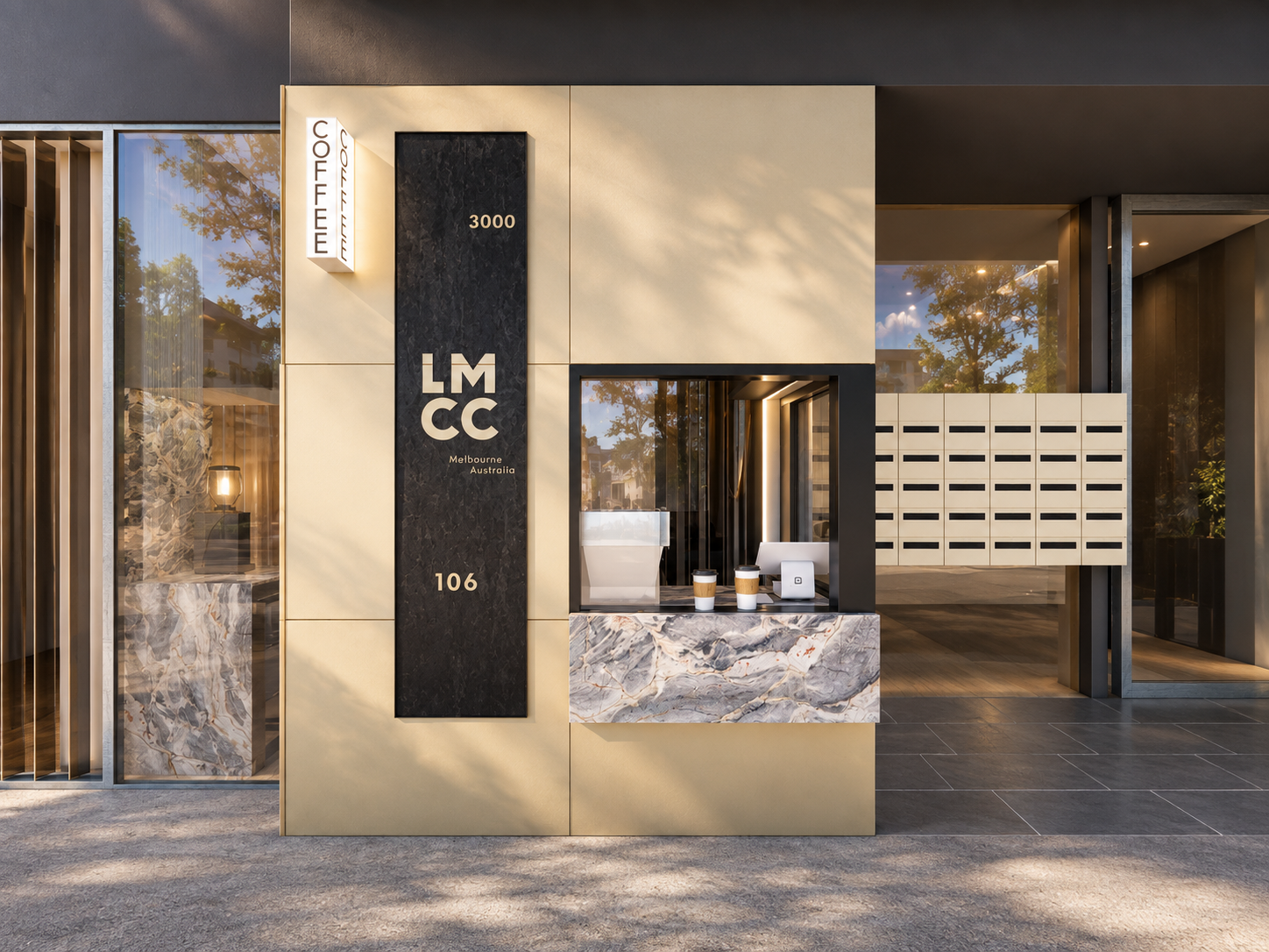 a refined street presence combines warm metallic cladding, dark detailing and expressive stone to create a distinctive café frontage.