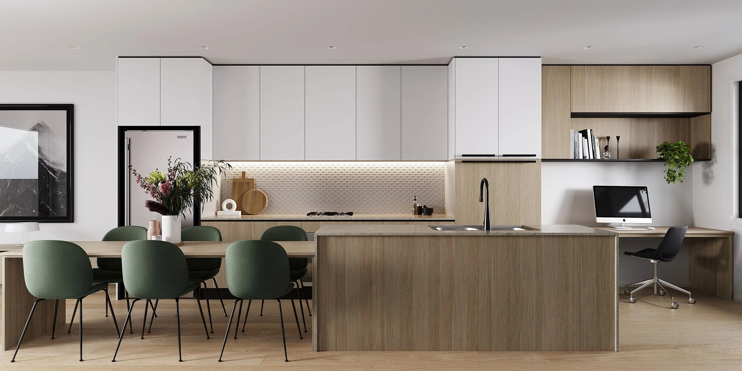 Modern kitchen with white cabinets, light wood accents, a dining table with green chairs, a computer desk, and minimal decor.