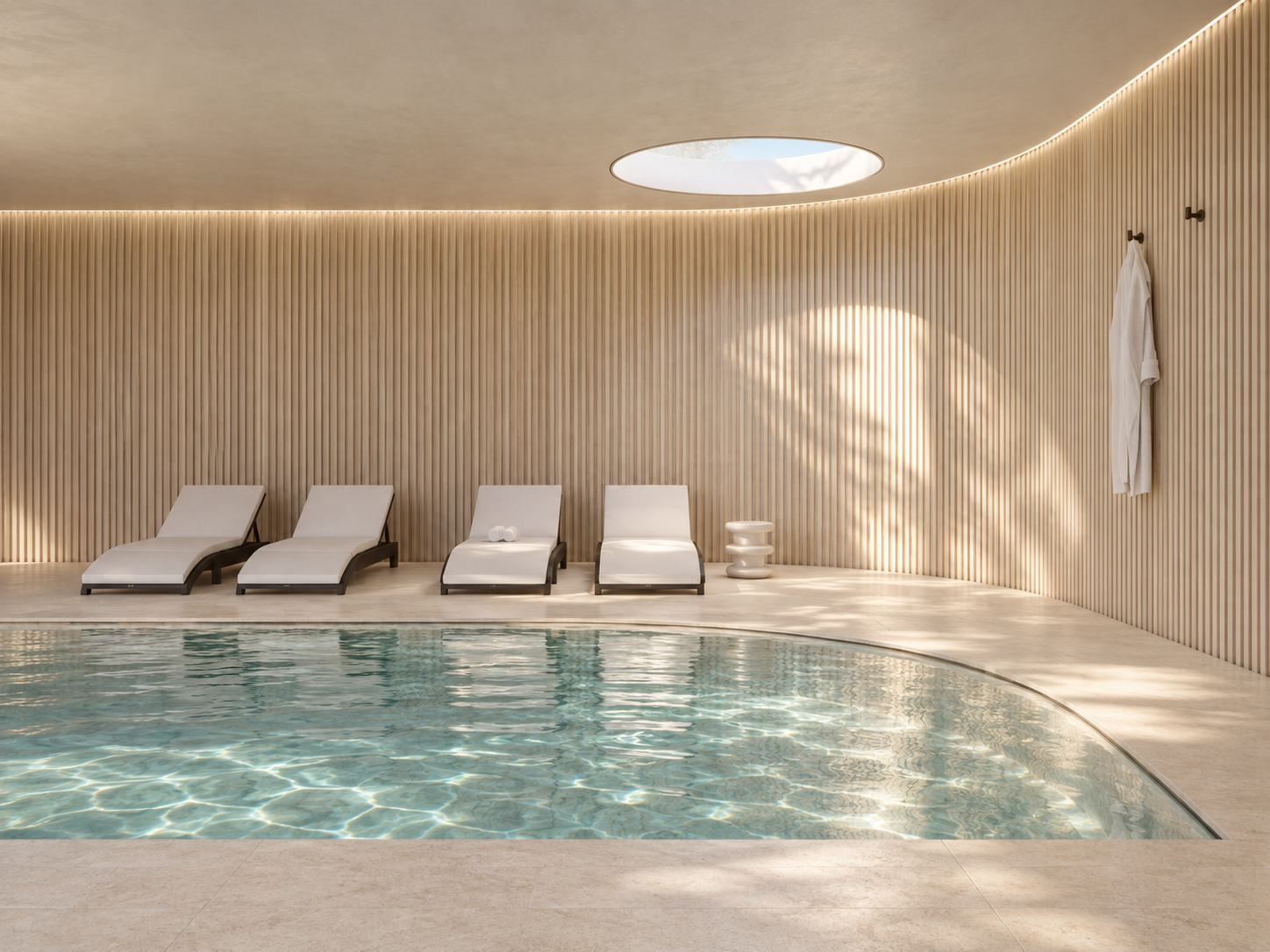 curved timber detailing, soft lighting and a restrained palette create a serene pool environment designed for relaxation and recovery.