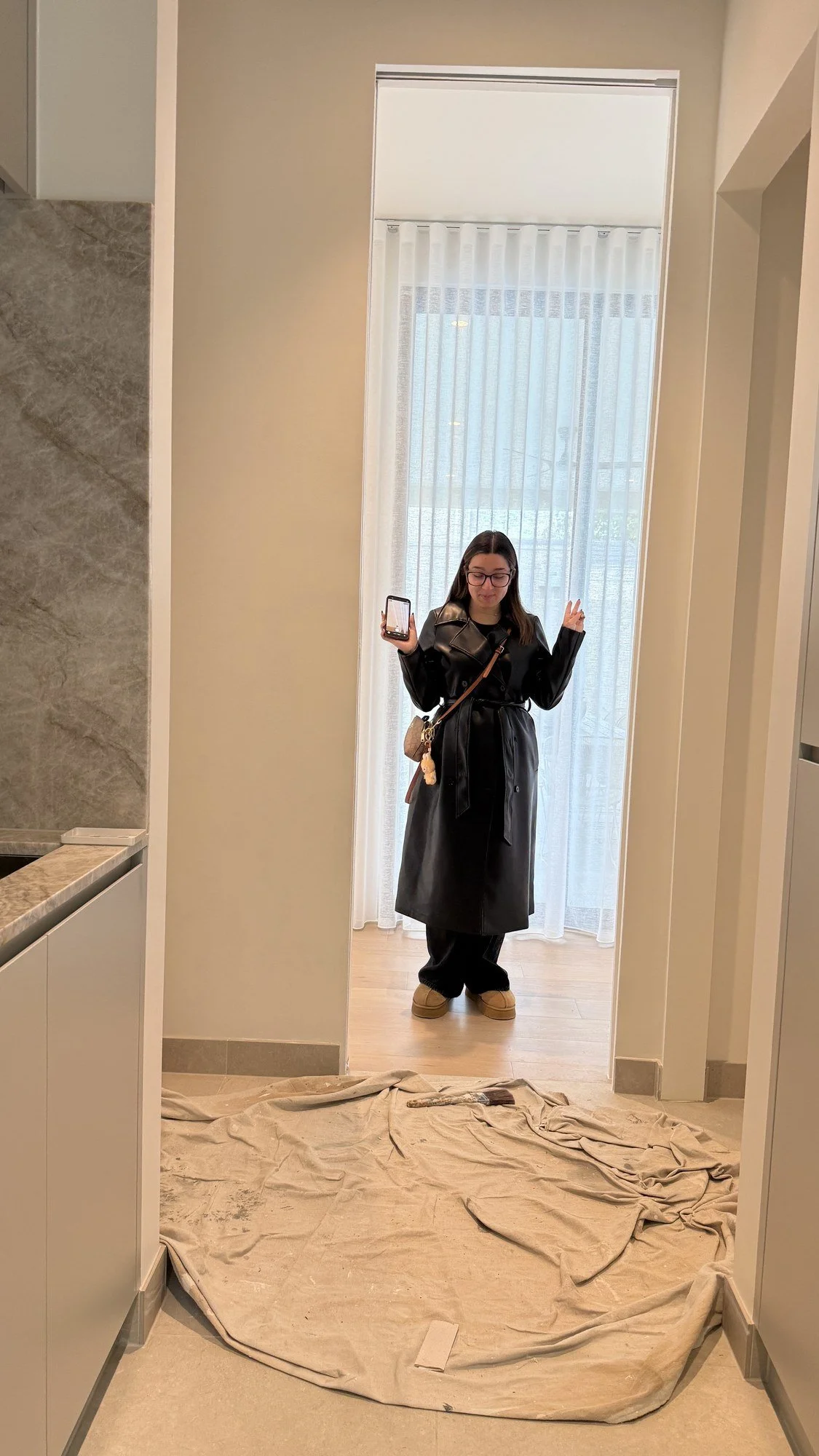 A photographer and tripod positioned to capture a completed interior.