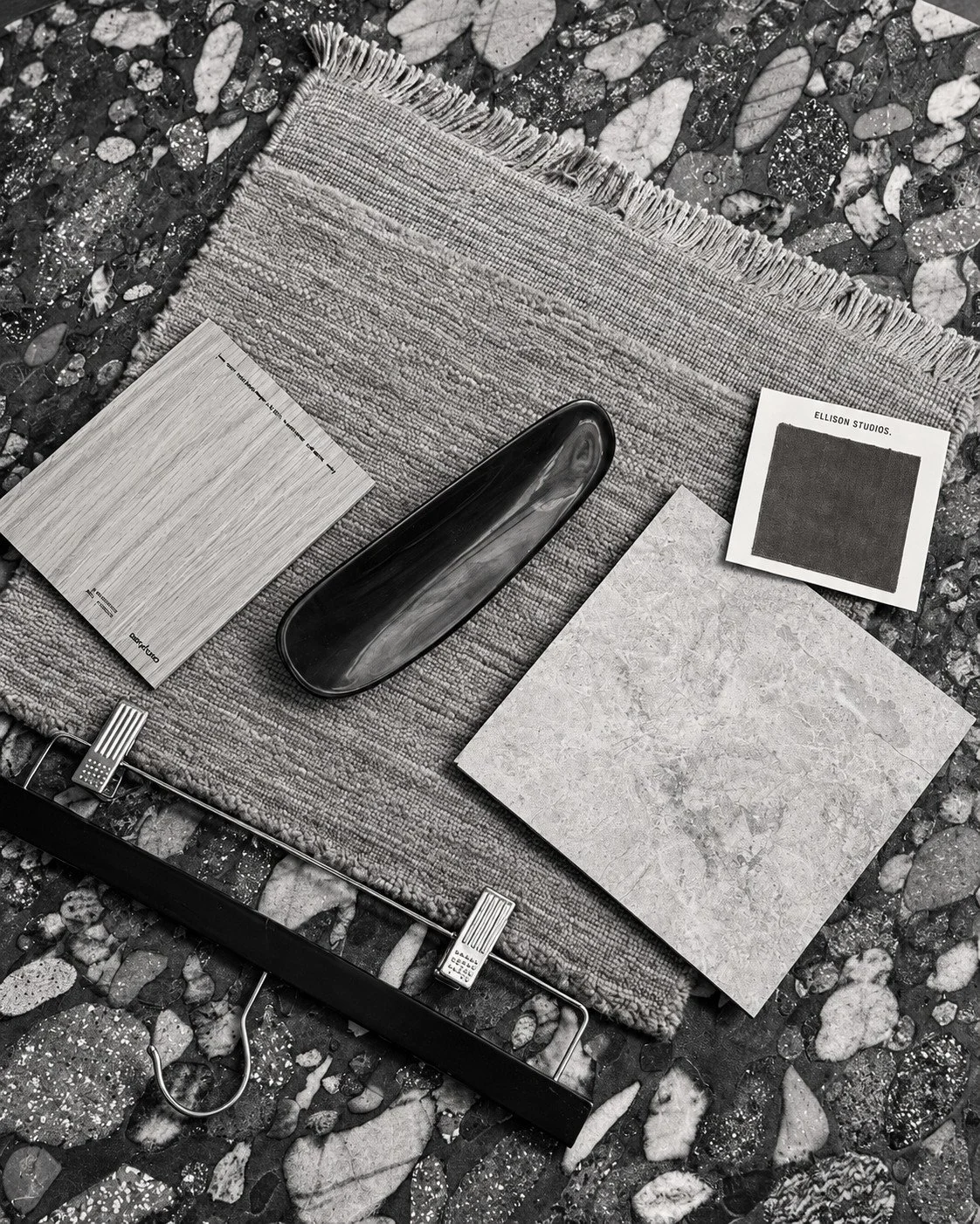 Lorde House material palette with stone, fabric and metal samples arranged together.