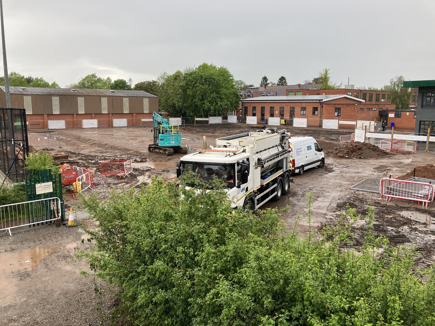 Landscape design meeting with the school:@etone.college, Alcema, @aspectlandscapeplanning and @fslprojects. The photo shows sewer diversion works and site level reduction, (not the landscape design) as seen in the rain from the new site accommodation