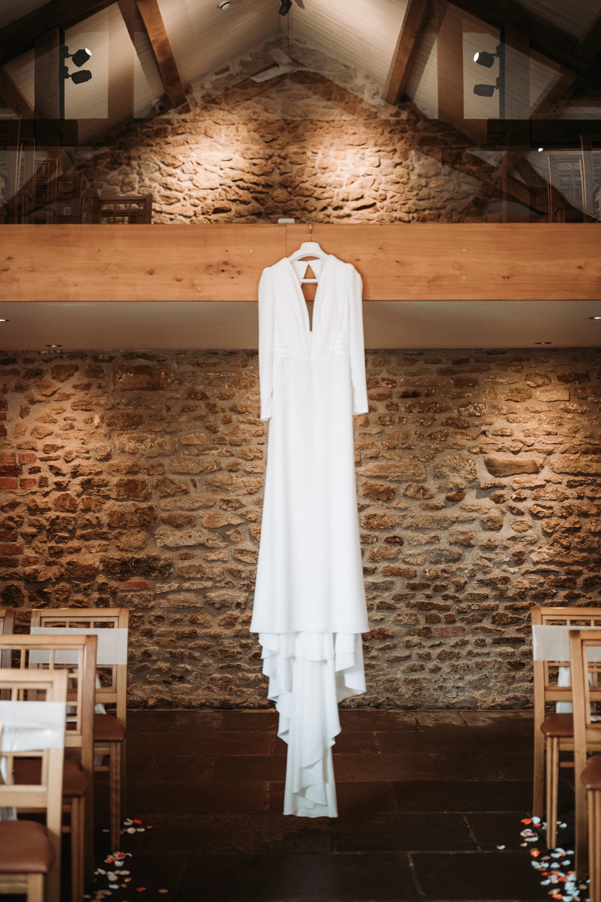 Dodford manor ceremony dress hanging from banister