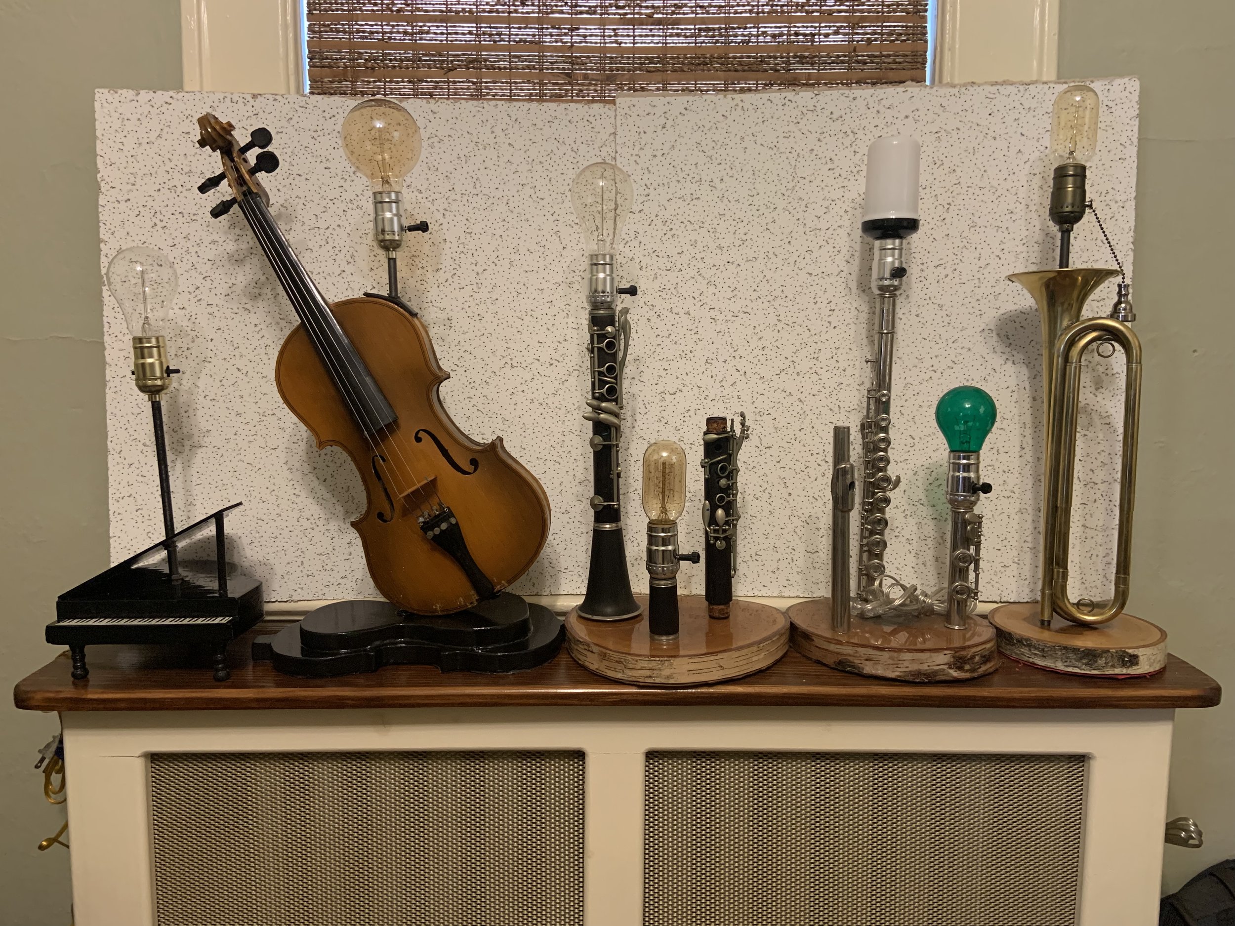 John Satir - Custom lamps made out of musical instruments such as flutes , clarinets, bugles and violins.