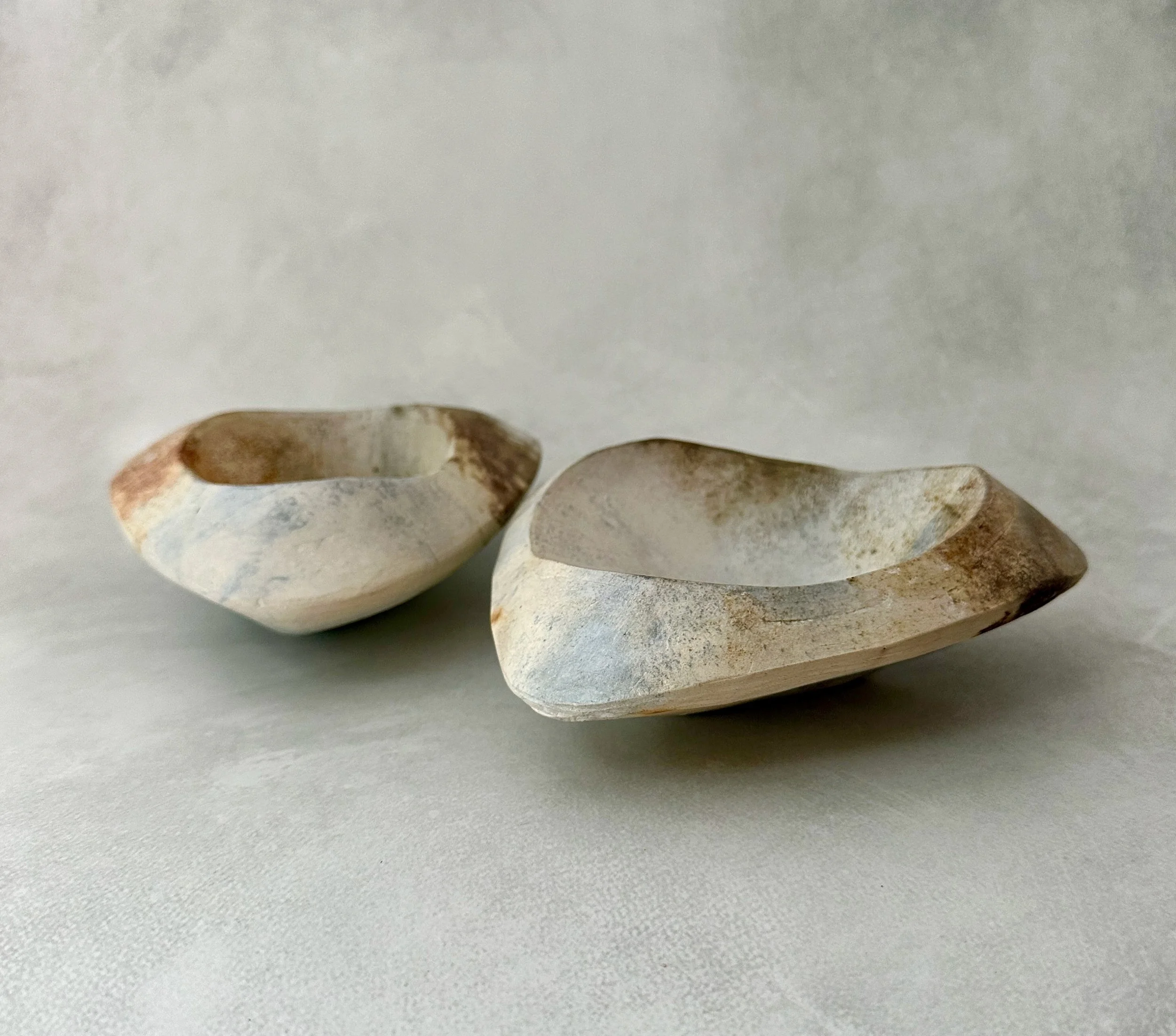 Ingrid Raab: Inspired by the geology of the Berkshires and the Maine coast, my work seeks to capture the silent, powerful presence of stones shaped by time and the elements. I utilize clay slabs to create hollow-forms, which  express a sense of weigh