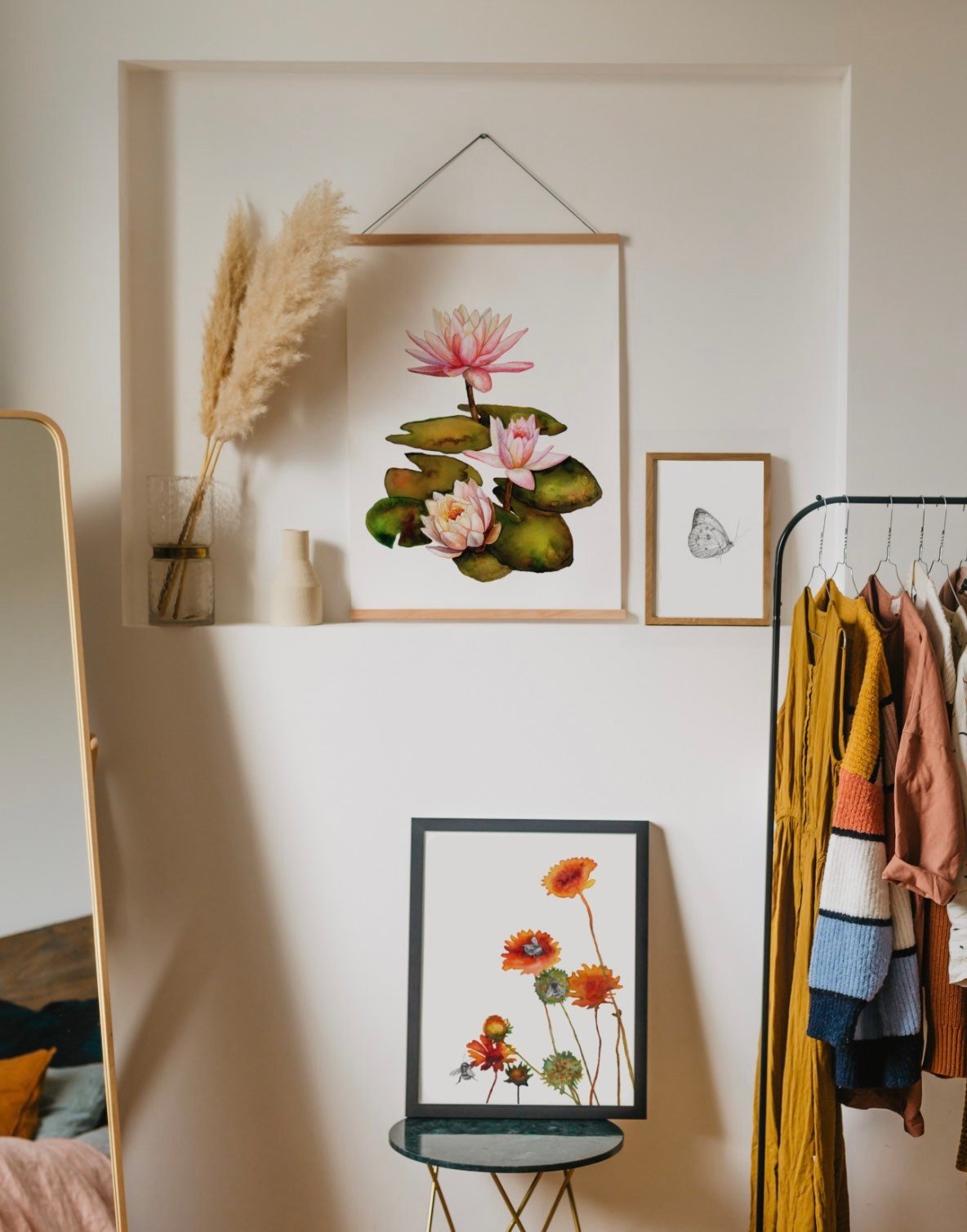 framed print of water lilies hanging in a bedroom