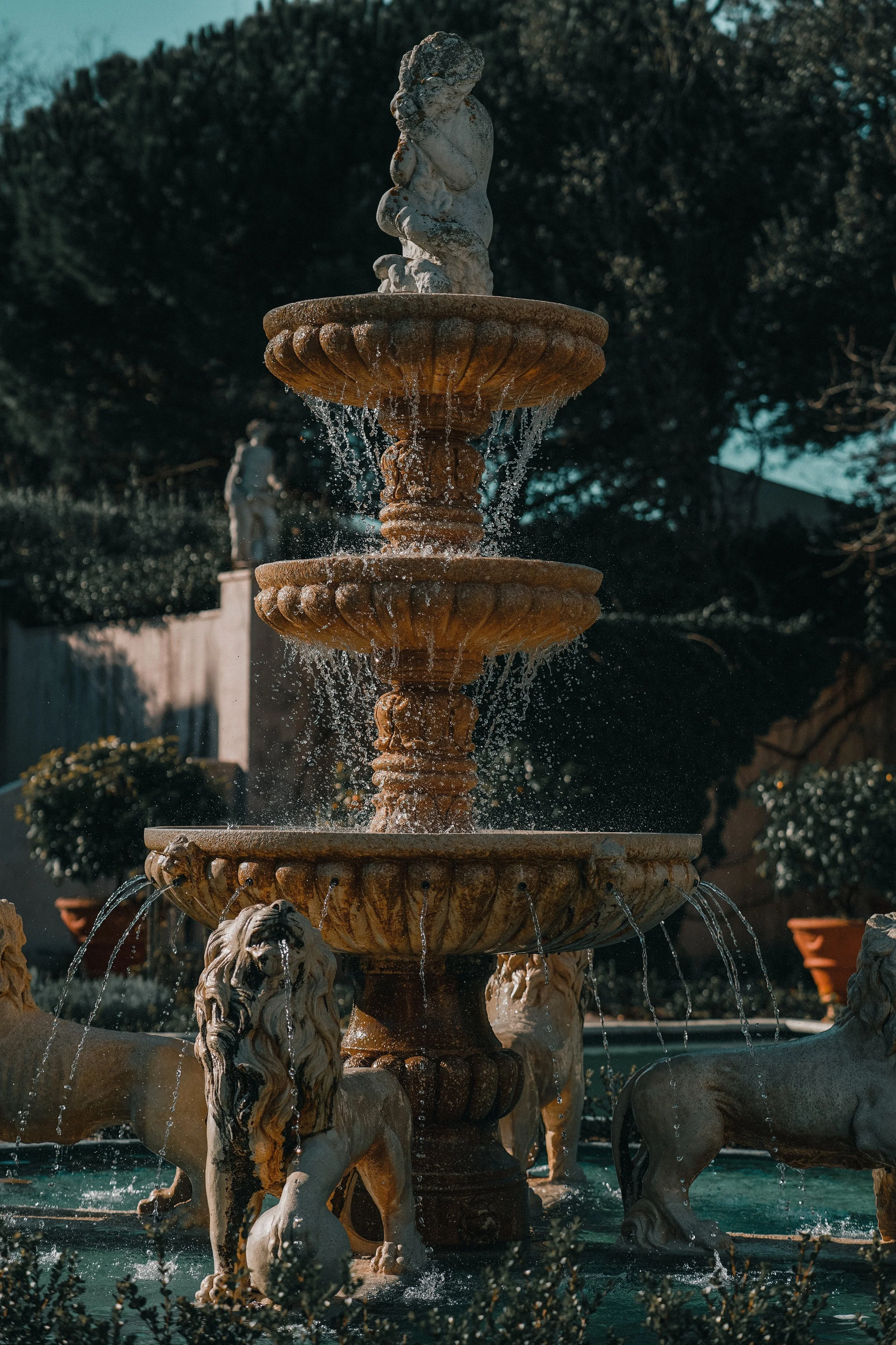 ADHD Woman's low energy symbolized by a weak and inconsistently flowing fountain.