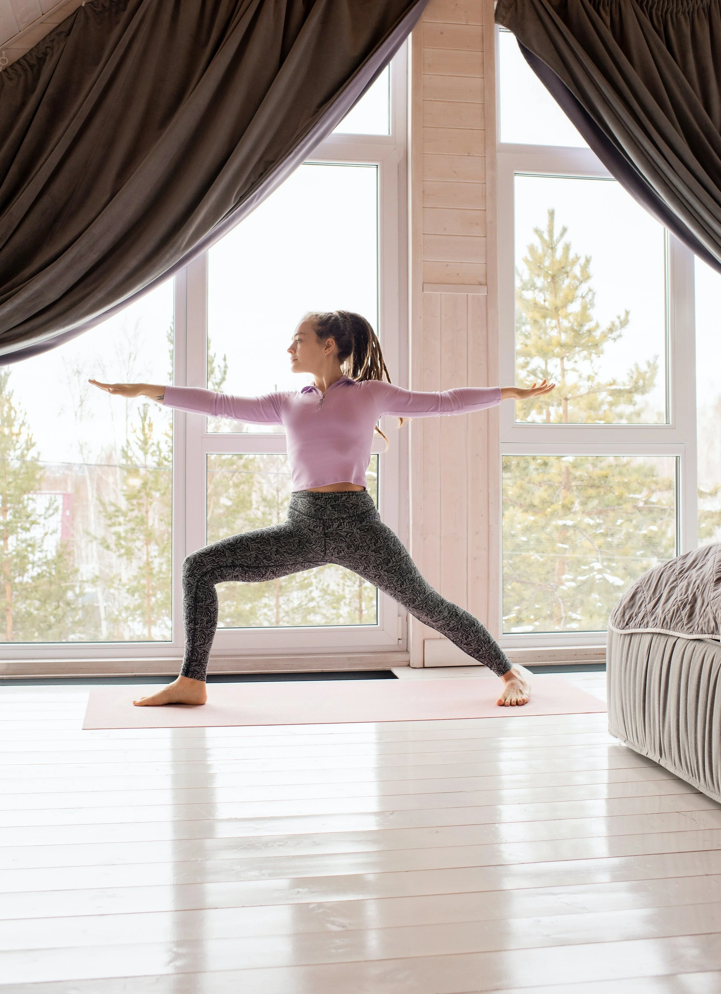 ADHD woman with trauma finding orientation, stability, and choice in warrior 2  yoga pose