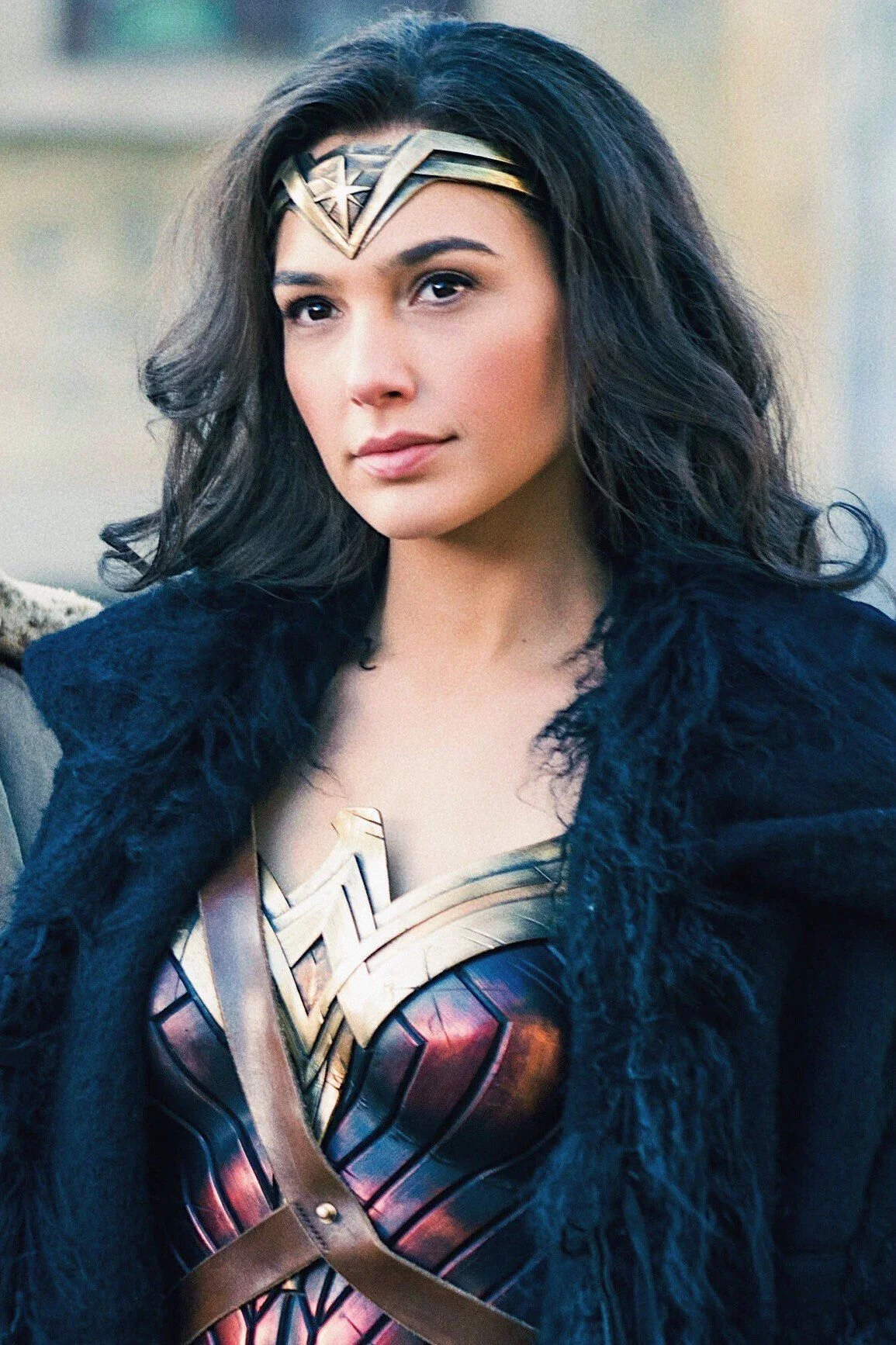 ADHD woman embodying her wonders of wisdom gained from intense emotions after EMDR therapy in North Carolina by wearing a wonder woman suit and headband covered by a black furry coat.