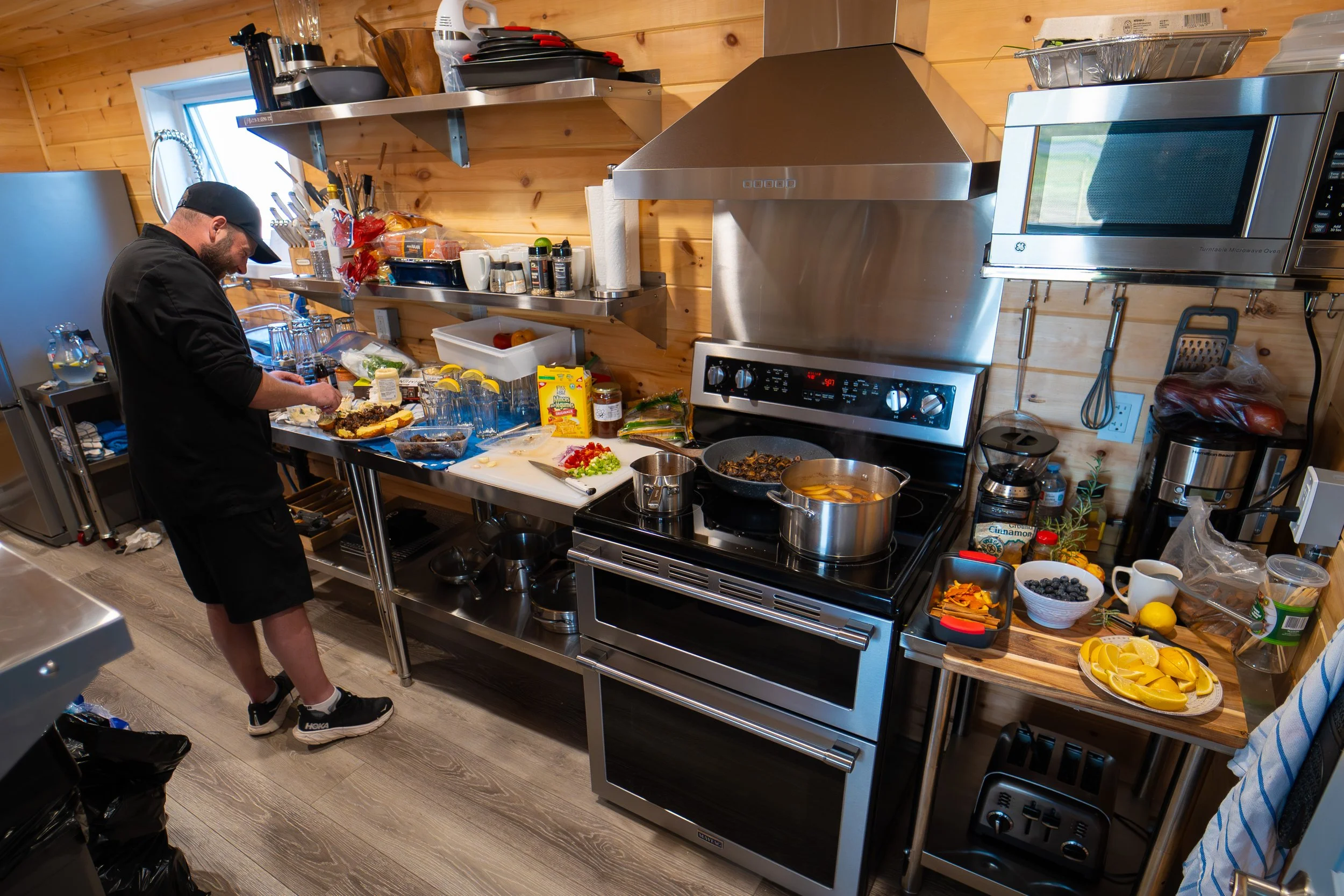 Ravens Rest Retreat Event - a man in the kitchen preparing food.jpg