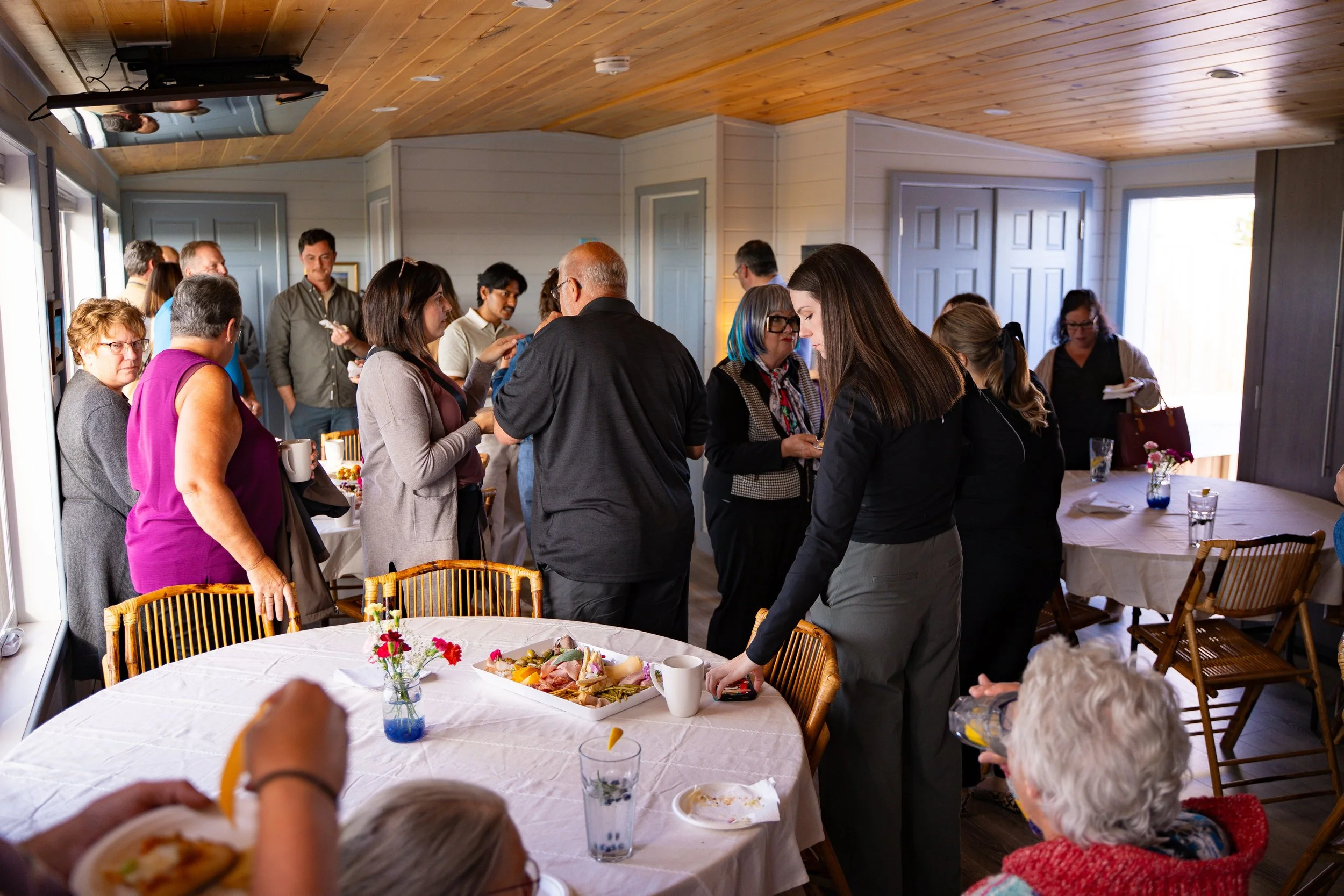 Ravens Rest Retreat Event - room full of people talking.jpg