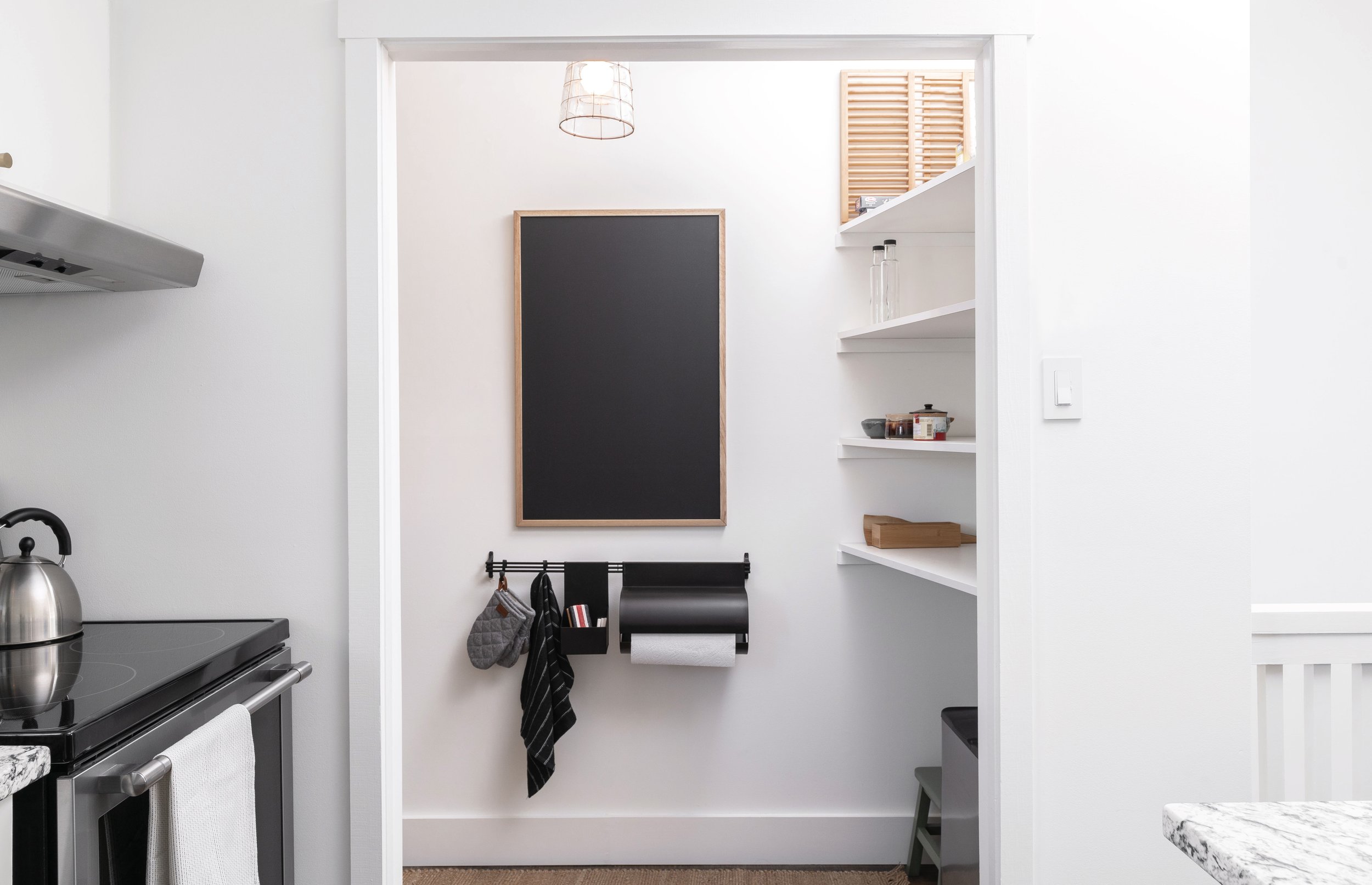 Leah Simpson Design pantry chalkboard interior organization black white modern