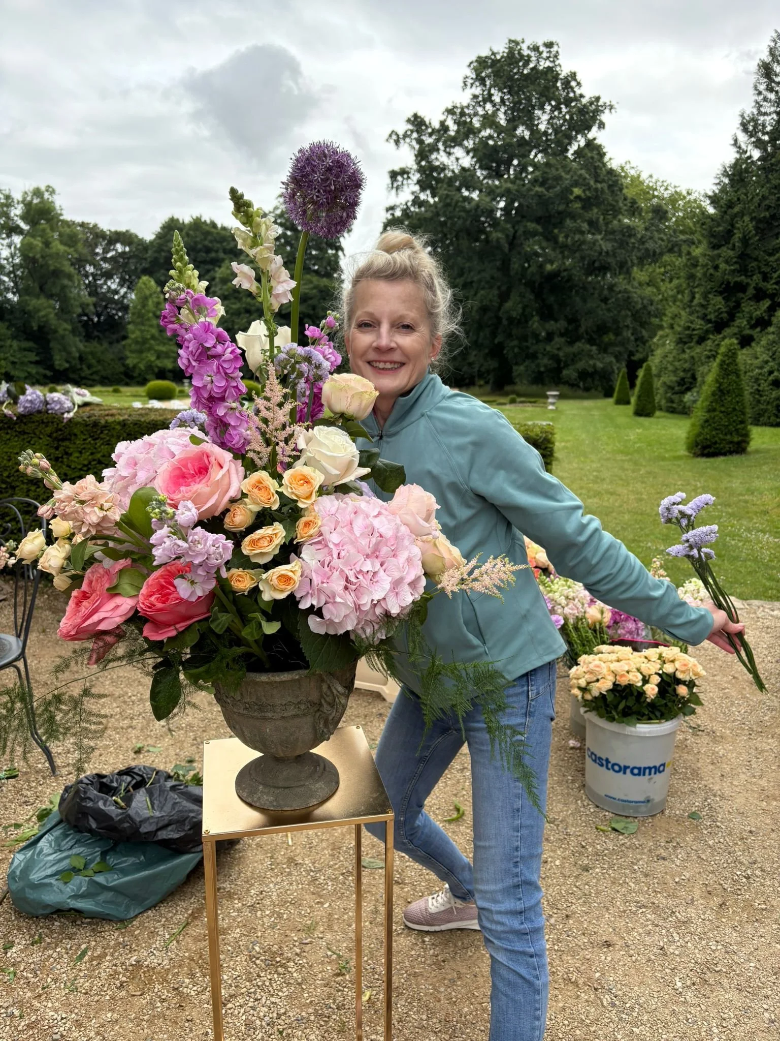 woman arranging flowers for a wedding in france