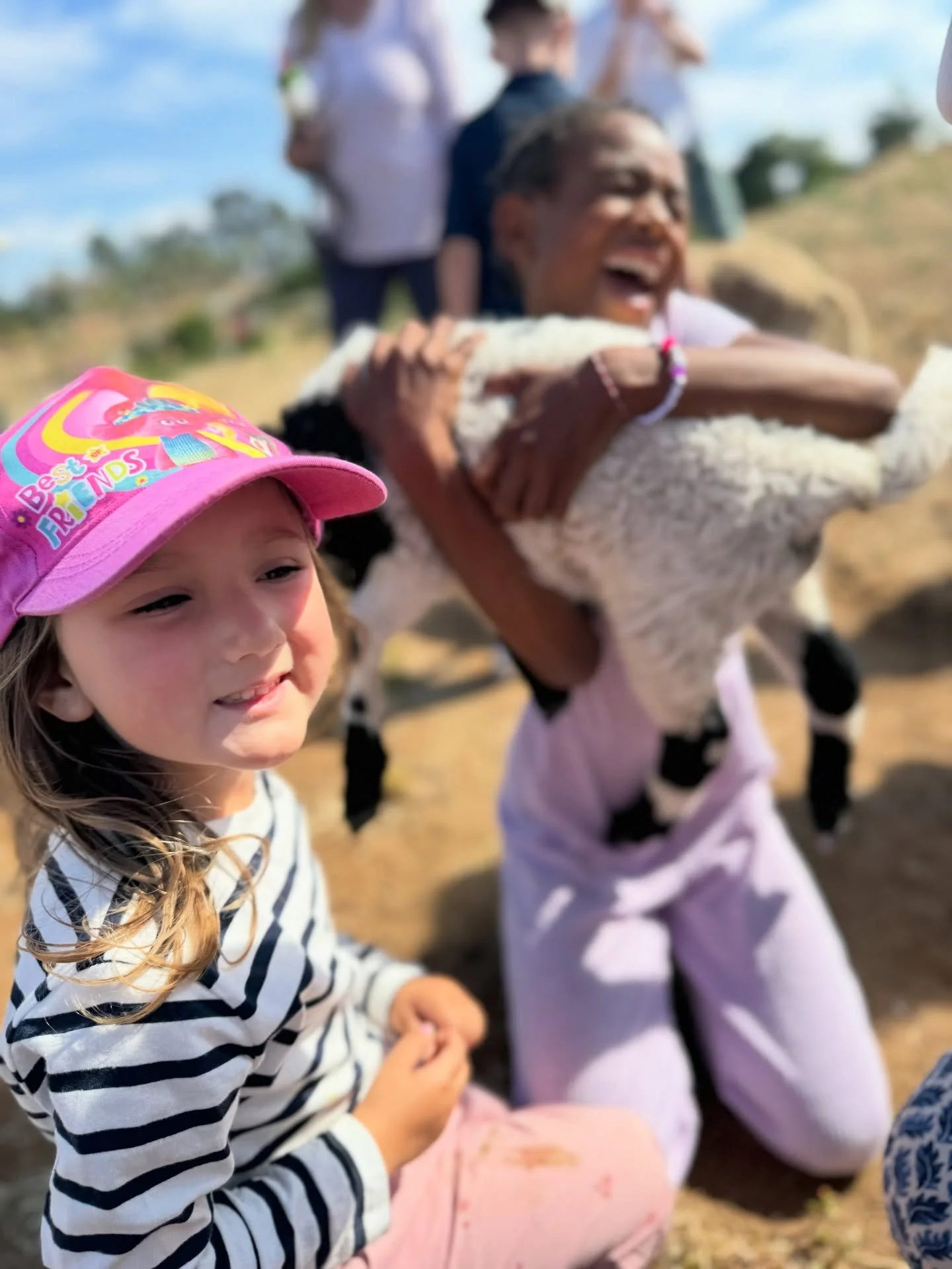 There&rsquo;s just something about being outside with baby goats that fills our hearts up real quick. Watching kids laugh and chase them around, hearing those little giggles echo through the blueberry patch, it reminds us why we do all of this in the
