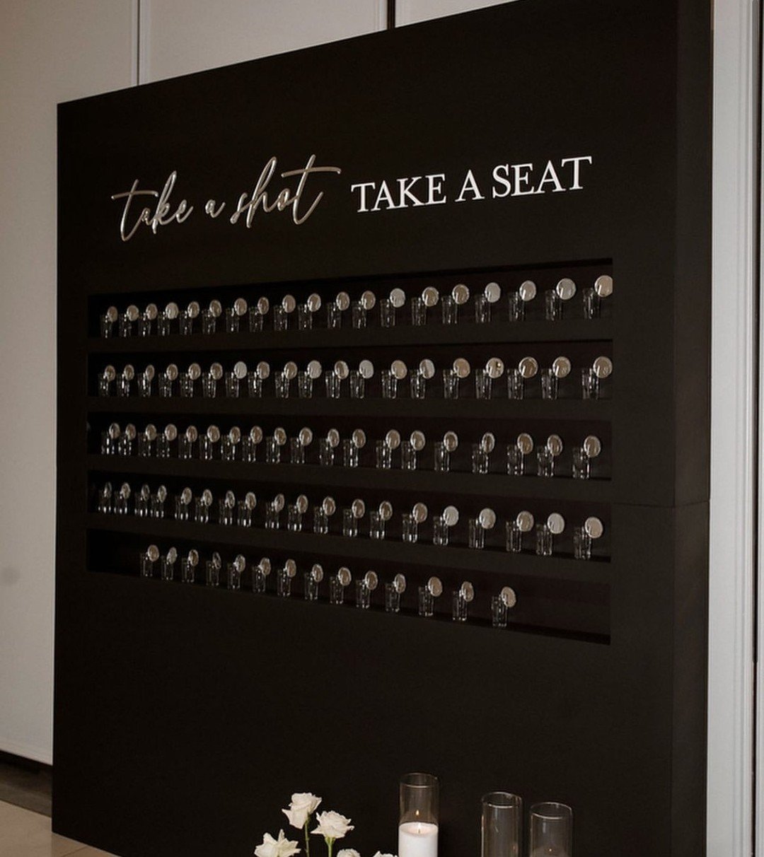Want an interactive idea for your wedding? Take a shot, and take a seat.🥂

We love a statement seating chart that will be sure to get guests talking!

For this seating chart, our couple came from a European background, where they celebrated every sp