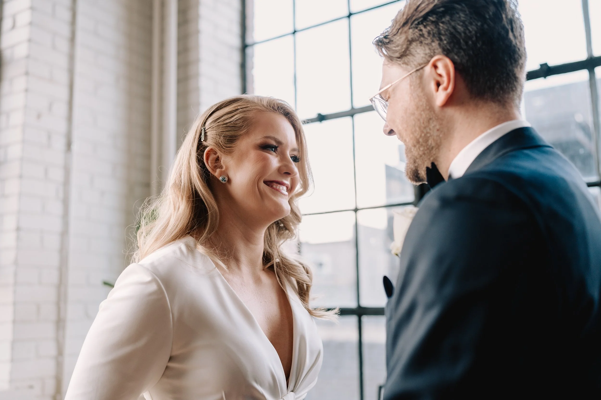 Bride and groom during emotional first look at Toronto wedding before studio ceremony