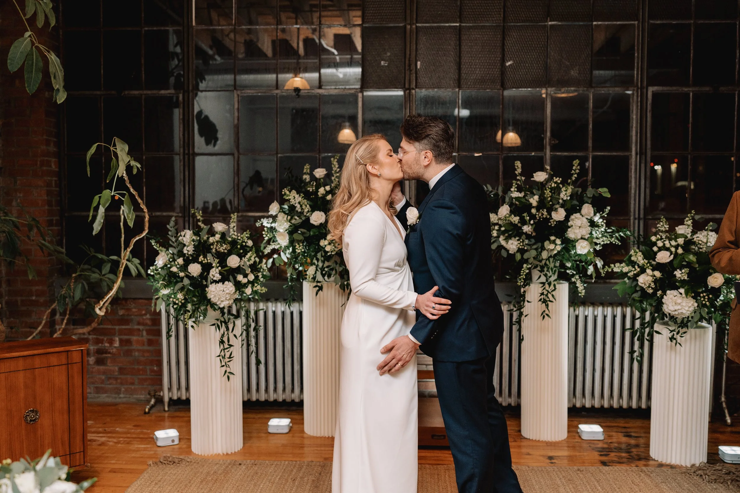 Couple sharing intimate moment during a downtown Toronto studio wedding ceremony