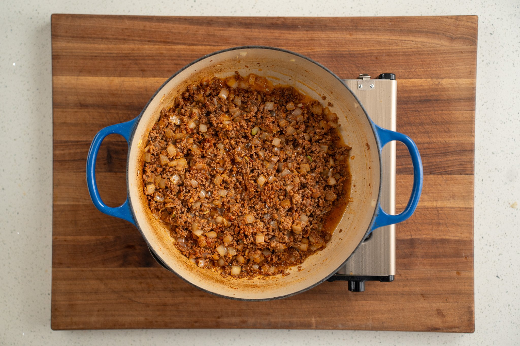 ground beef with cooked tomato paste