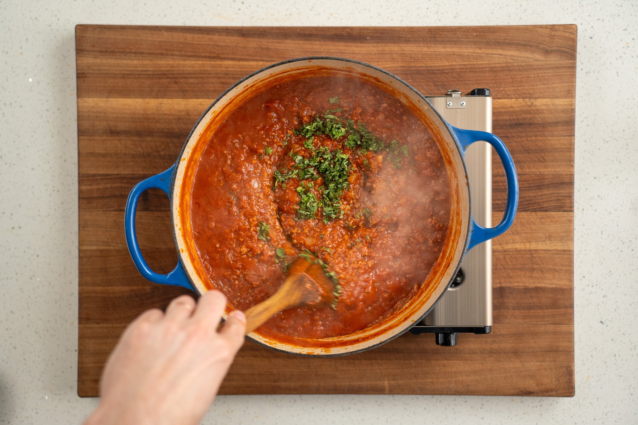 fresh basil in meat sauce