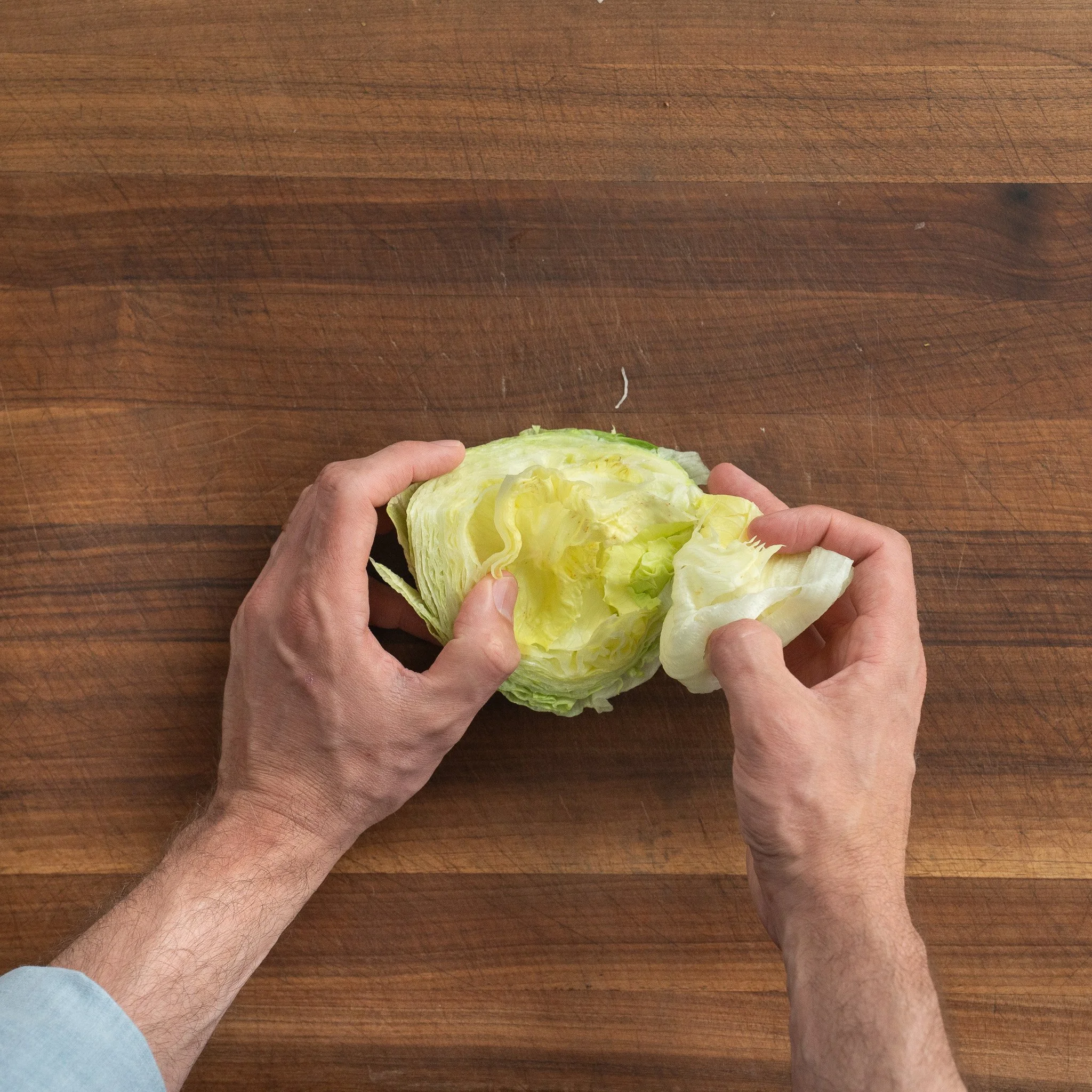 removing inner leaves from iceberg lettuce wedges