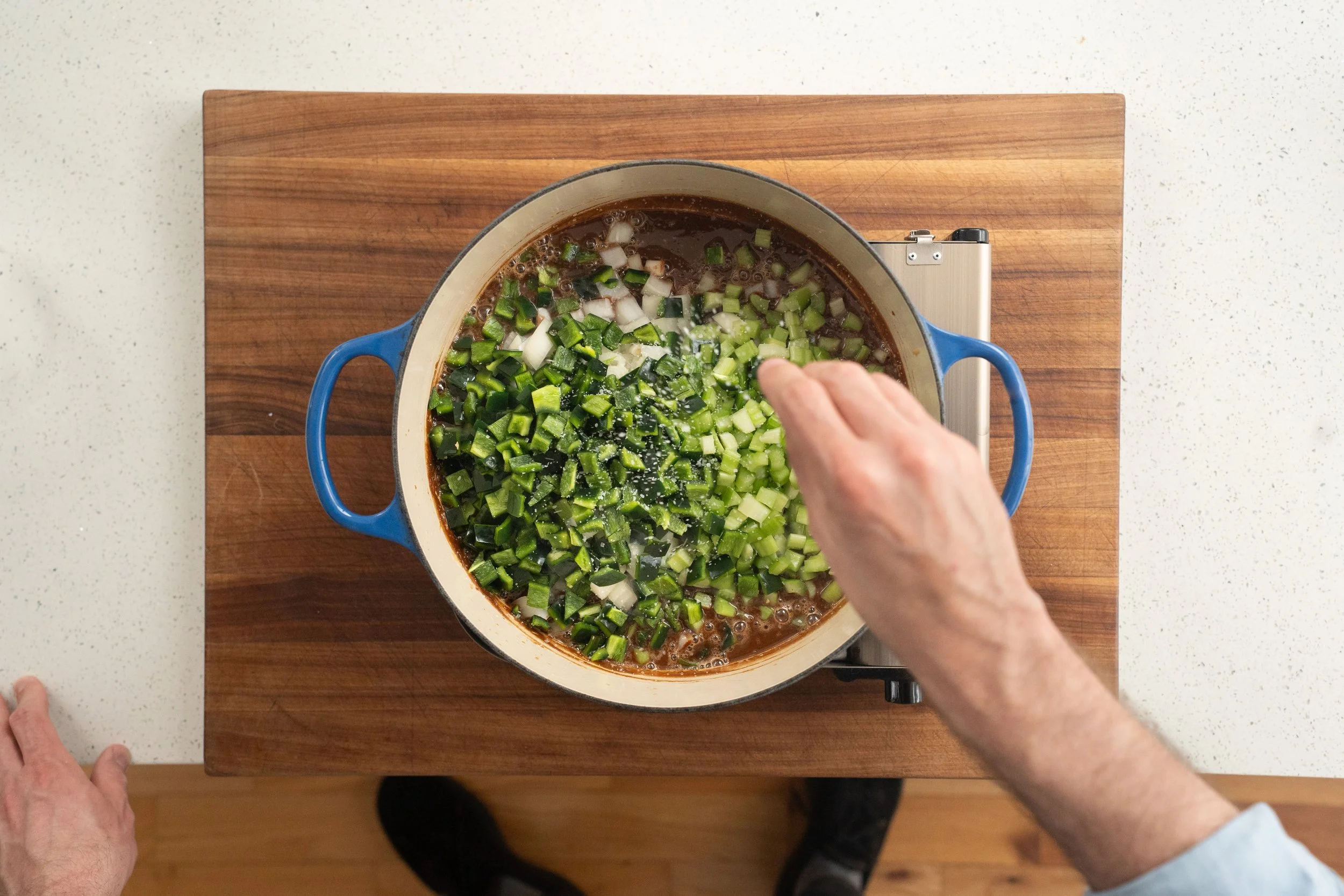 adding poblanos celery and onion into roux