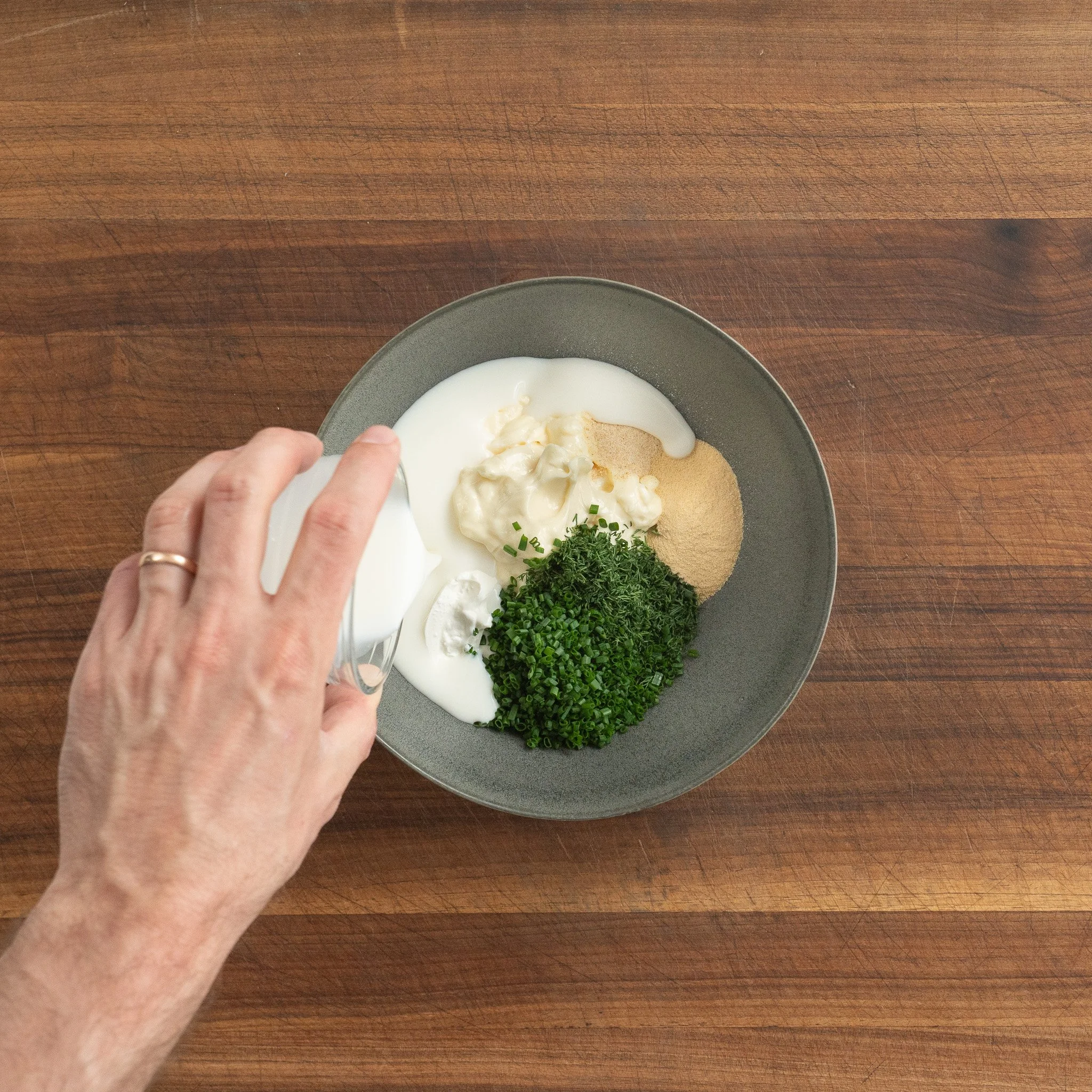 blue cheese dressing ingredients in a grey bowl