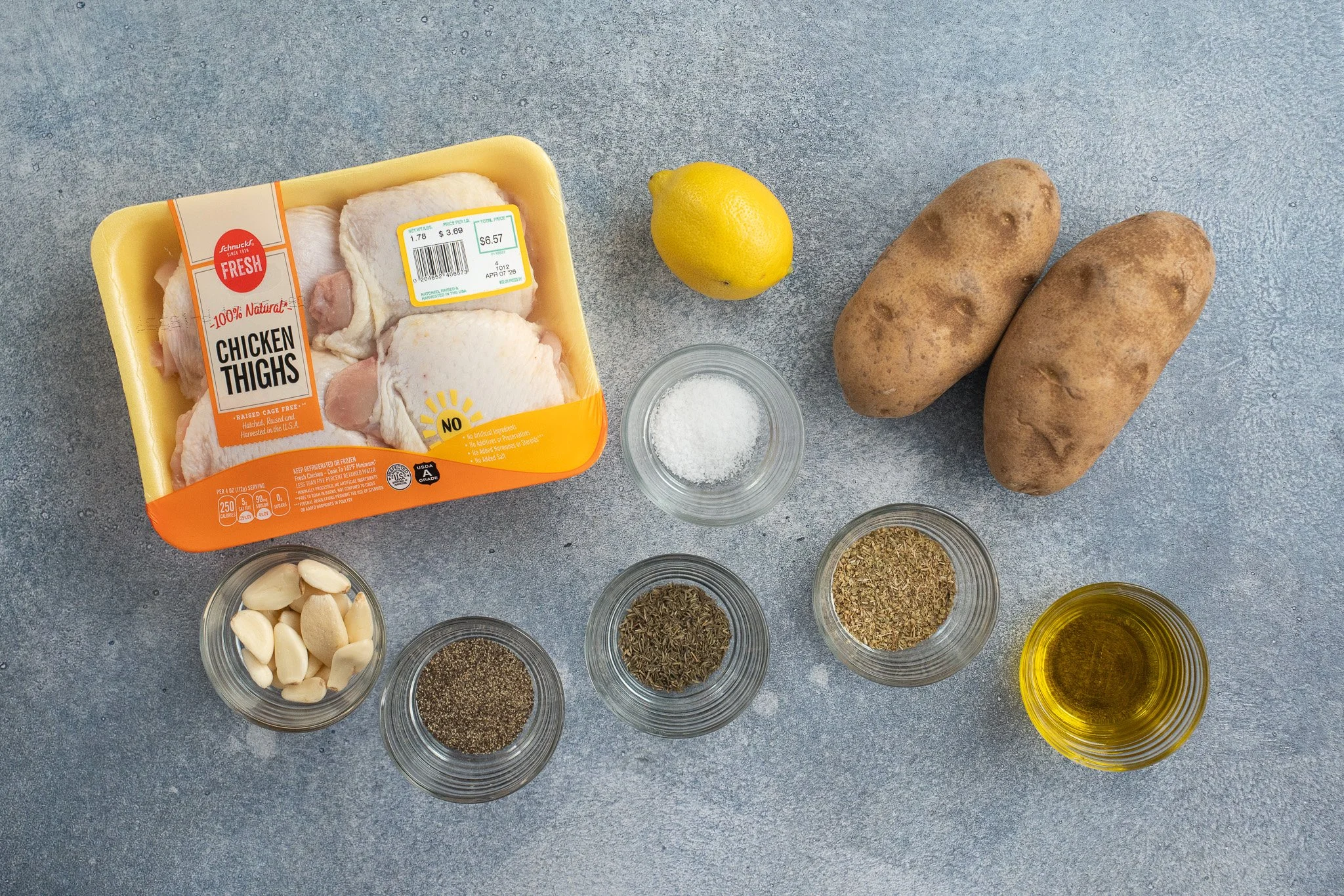 chicken thighs potatoes lemon garlic and spices