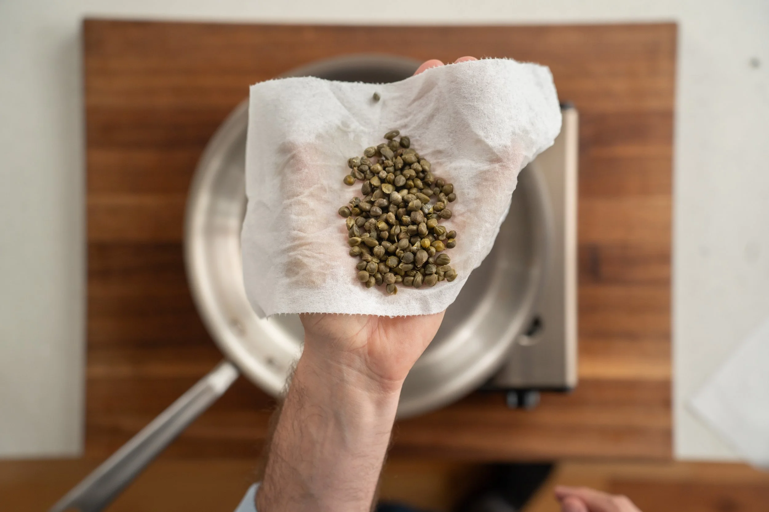 dried capers on a paper towel