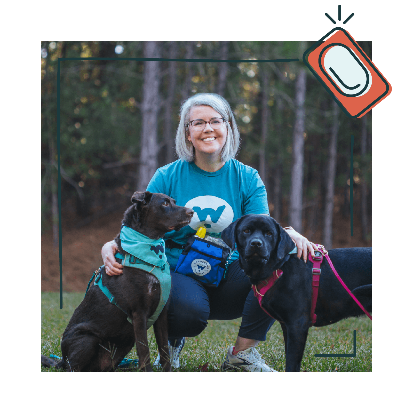 Wonderdog Training owner and certified professional dog trainer Eryn Rolison sits with her two labs during a training session.