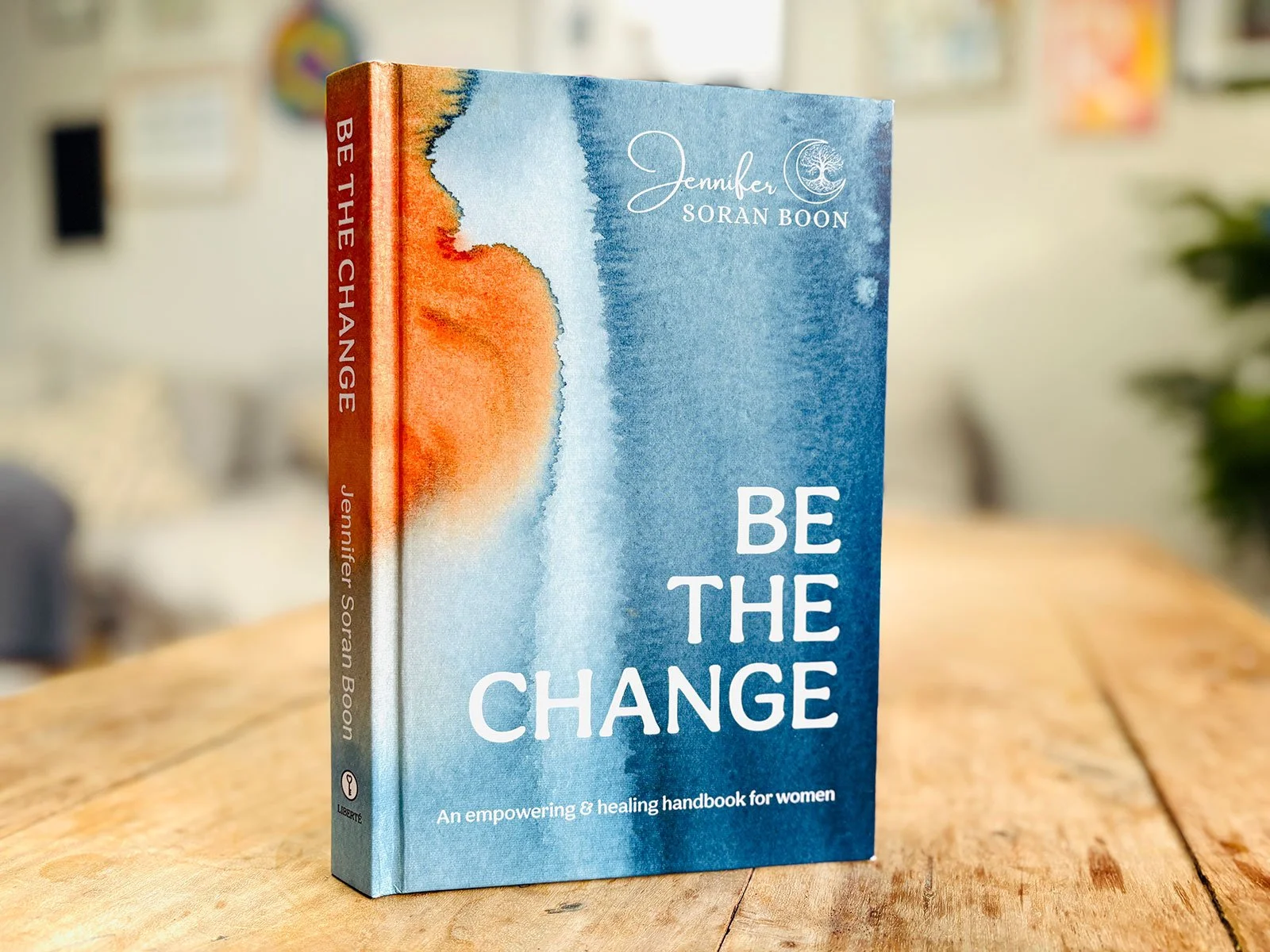 Be The Change Book by Jennifer Soran Boon, featuring a magic portal artwork in blue and orange on the cover