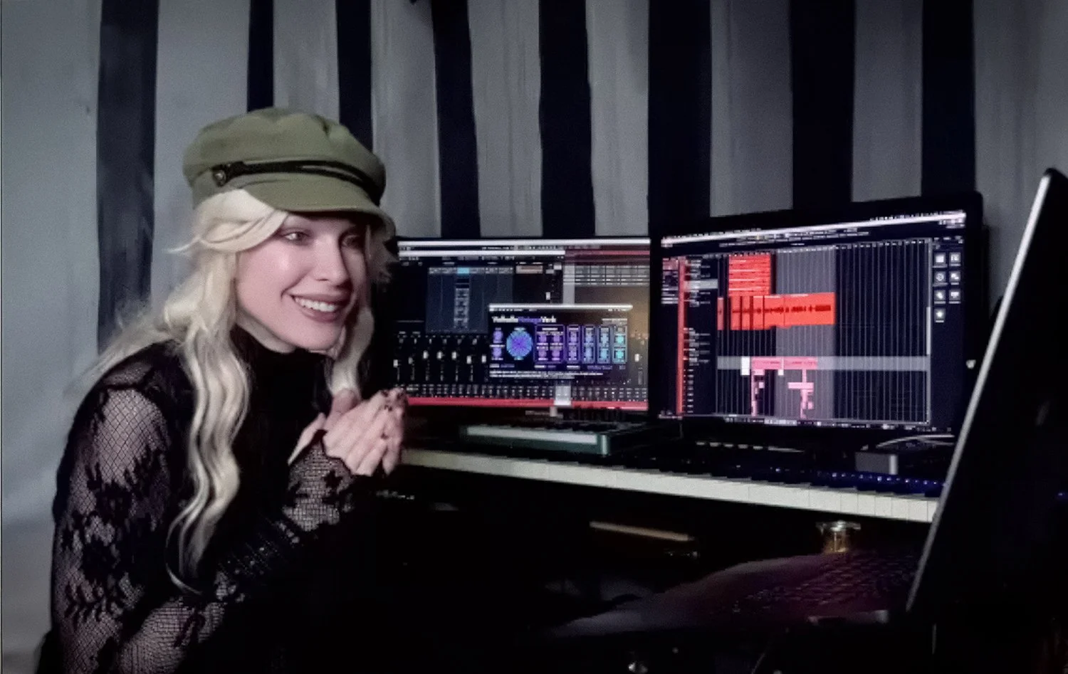 Emilie Autumn in the recordings studio smiling.